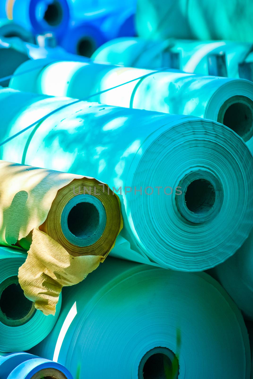 rolls of blue medical paper at a paper mill by paddythegolfer