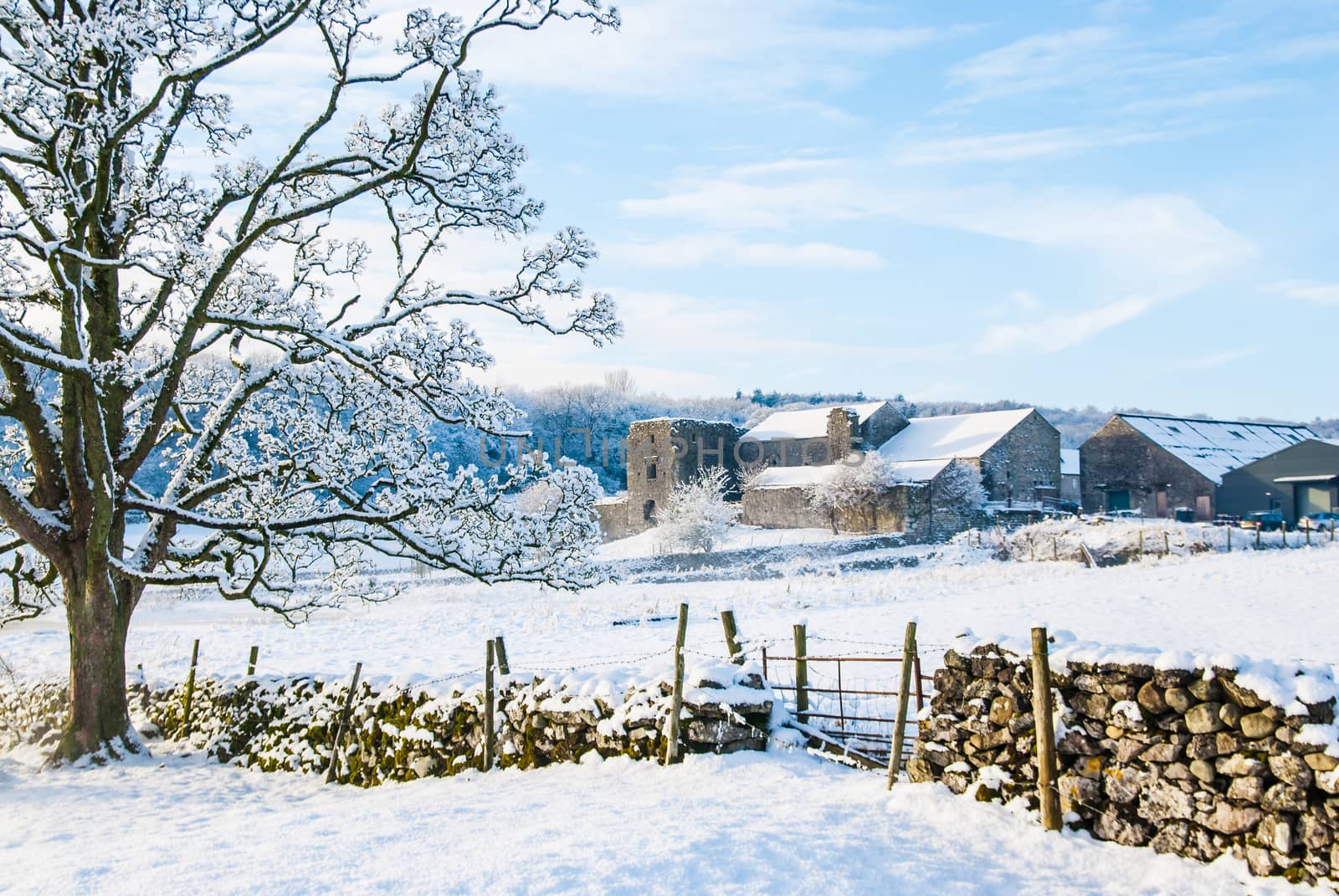 Beetham Hall on a snowey Winters day with dry stone wall and gate in foreground by paddythegolfer