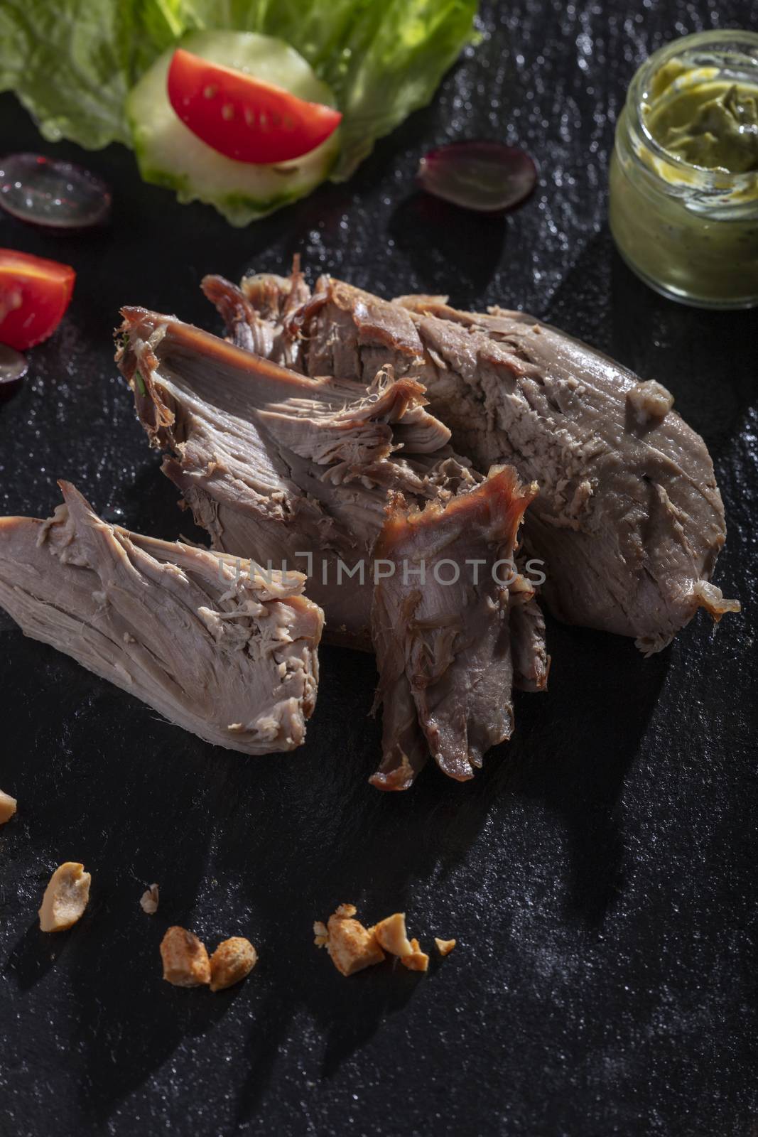 grilled duck on a wooden cutting board