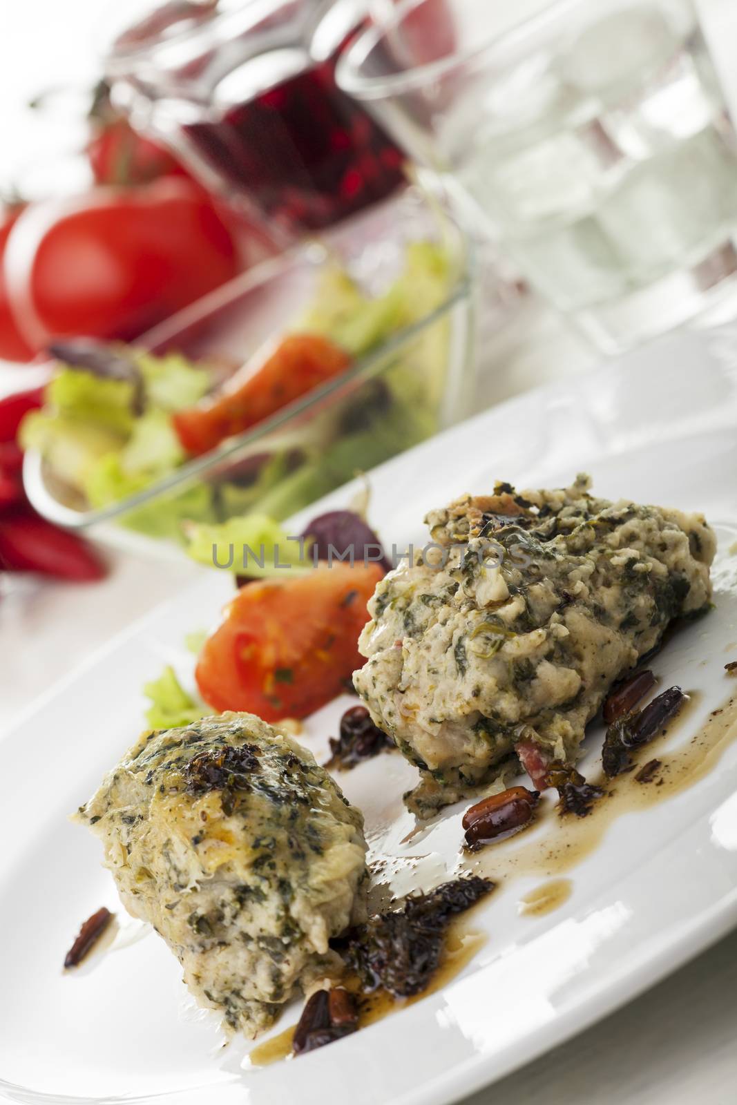 italian strangolapreti dumplings on a plate