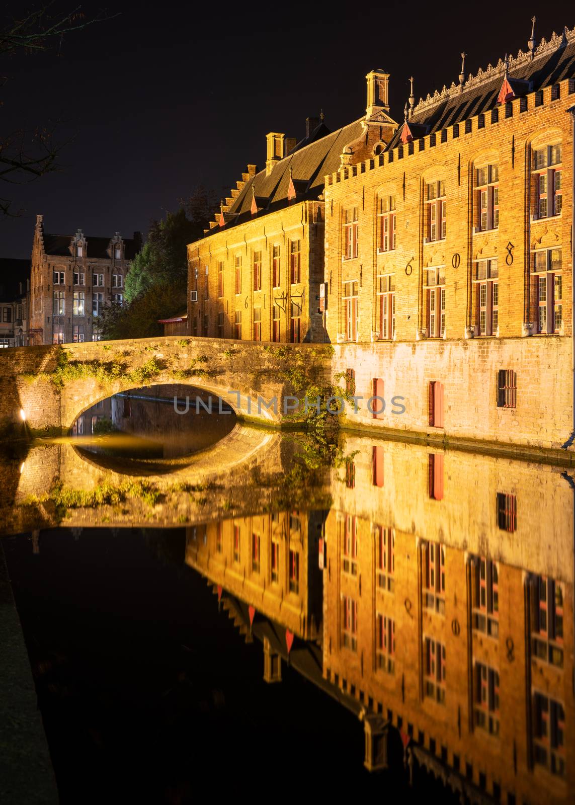 Evening mood with illuminated buildings in the historic city of Bruges, Belgium