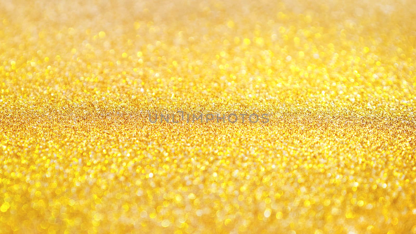 Yellow abstract background with shiny glitter. Golden festive sparkling macro texture. Holiday backdrop with copy space.