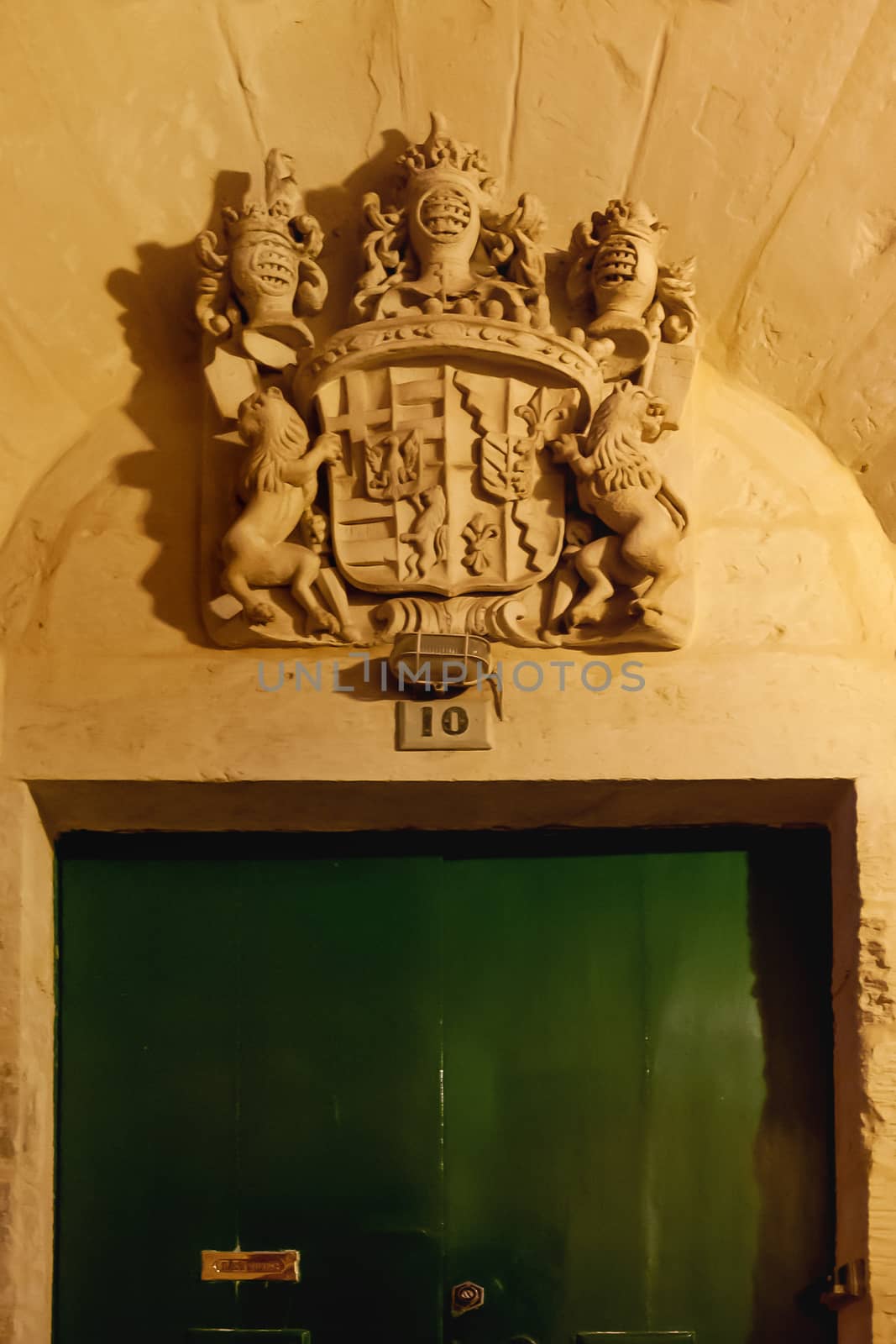Illuminated coat of arms with heraldic lion. Architectural detail over entrance door. Mdina, ancient capital of Malta.