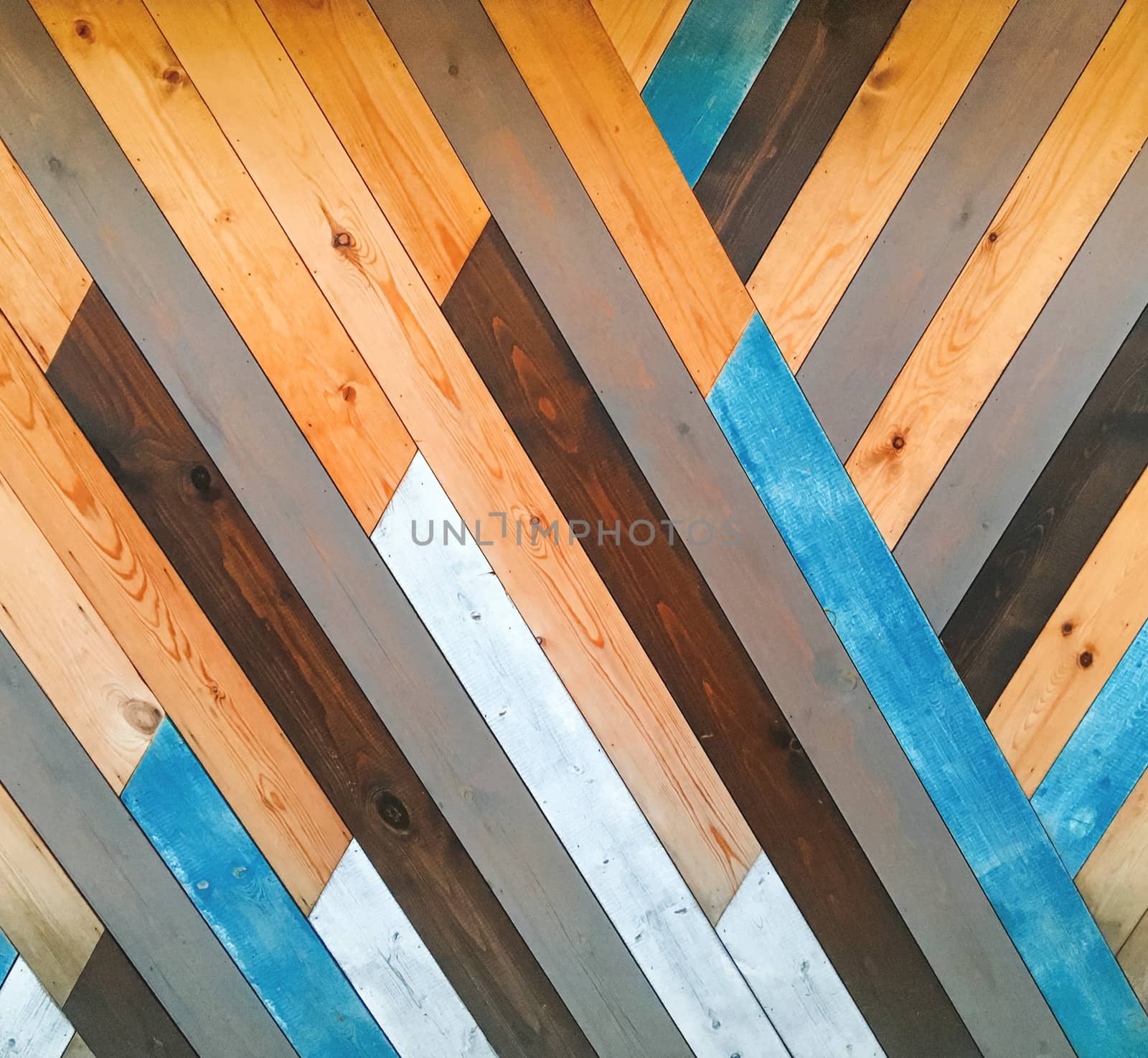 Wooden background with diagonal boards. Mixed colorful textured backdrop. by aksenovko