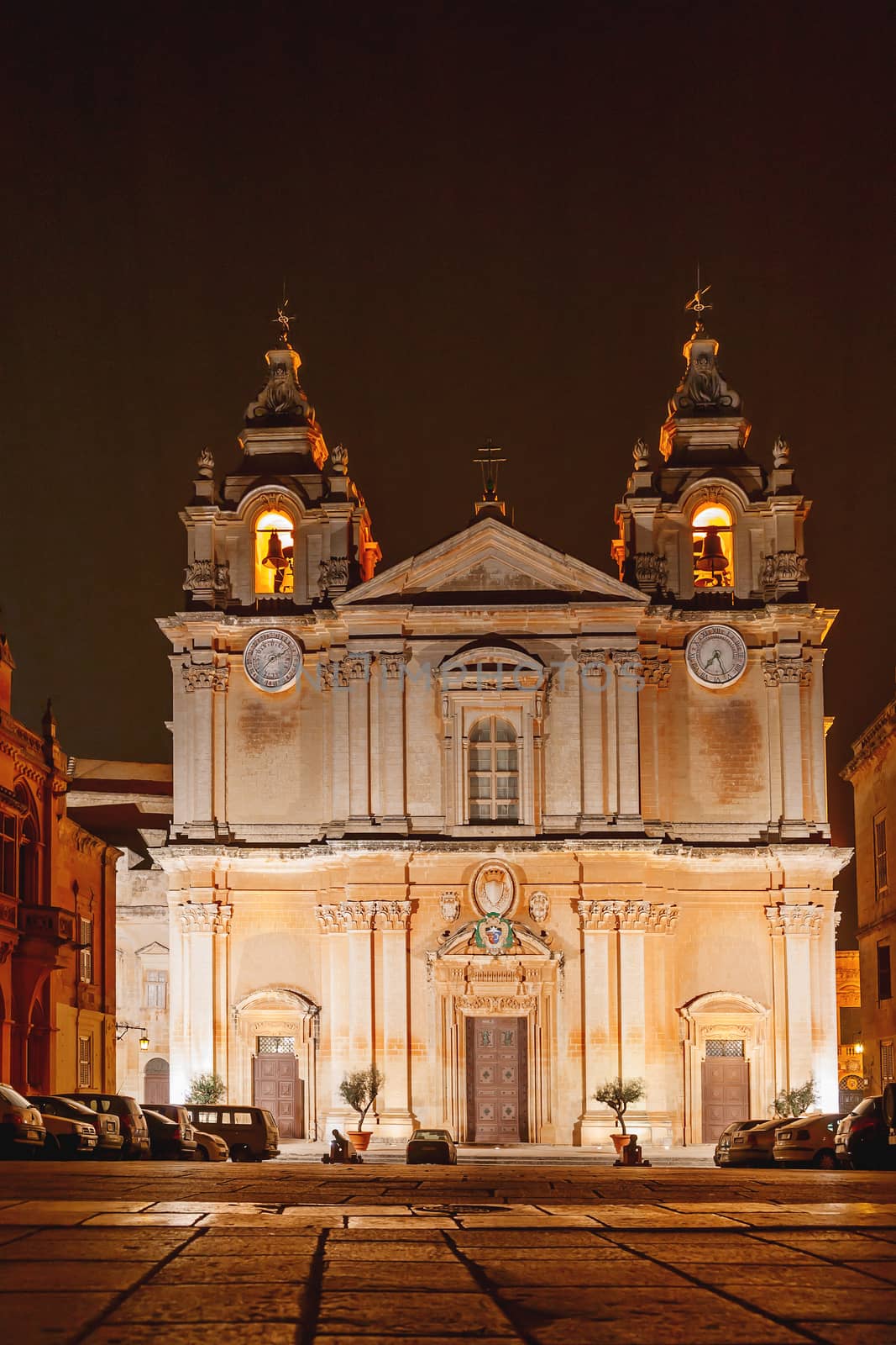 Illuminated Metropolitan Cathedral of Saint Paul, commonly known as St Paul's Cathedral or the Mdina Cathedral. Night view on Roman Catholic cathedral in Mdina, Malta. by aksenovko