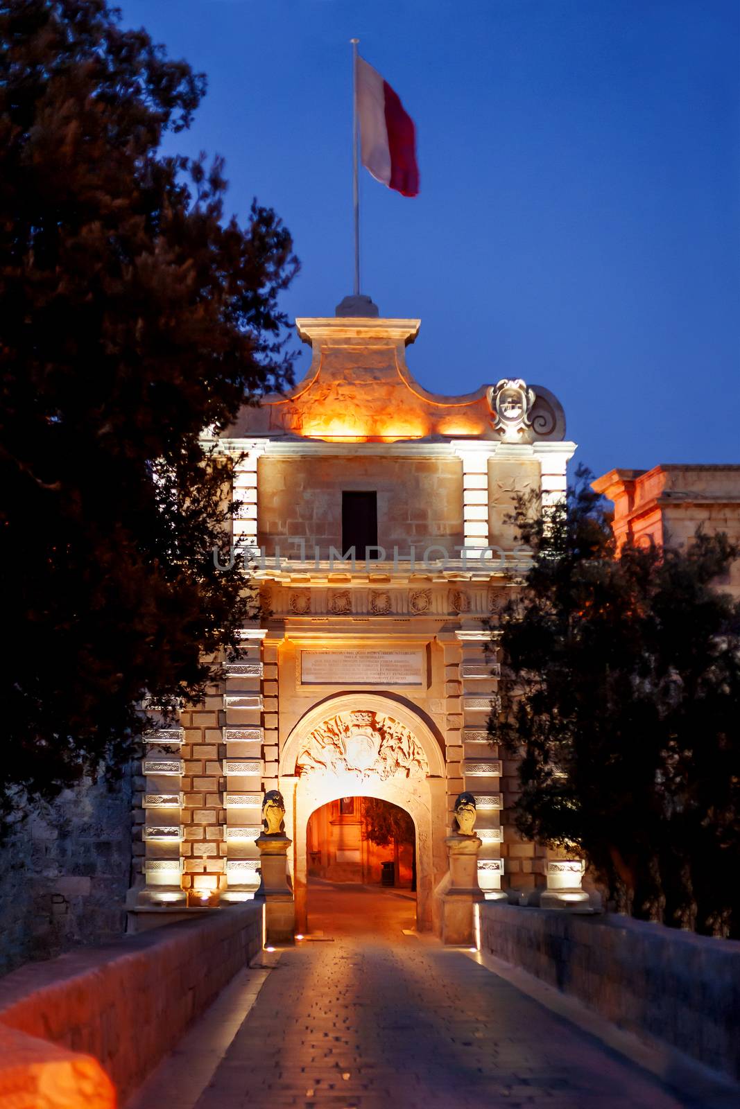 Illuminated Gate of Mdina, ancient capital of Malta. Night view on entrance into ancient town. by aksenovko