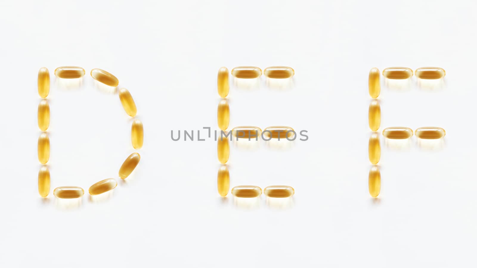 Letters D, E, F made of transparent yellow pills. Part 2 of latin alphabet in medical style. Isolated on white background. by aksenovko