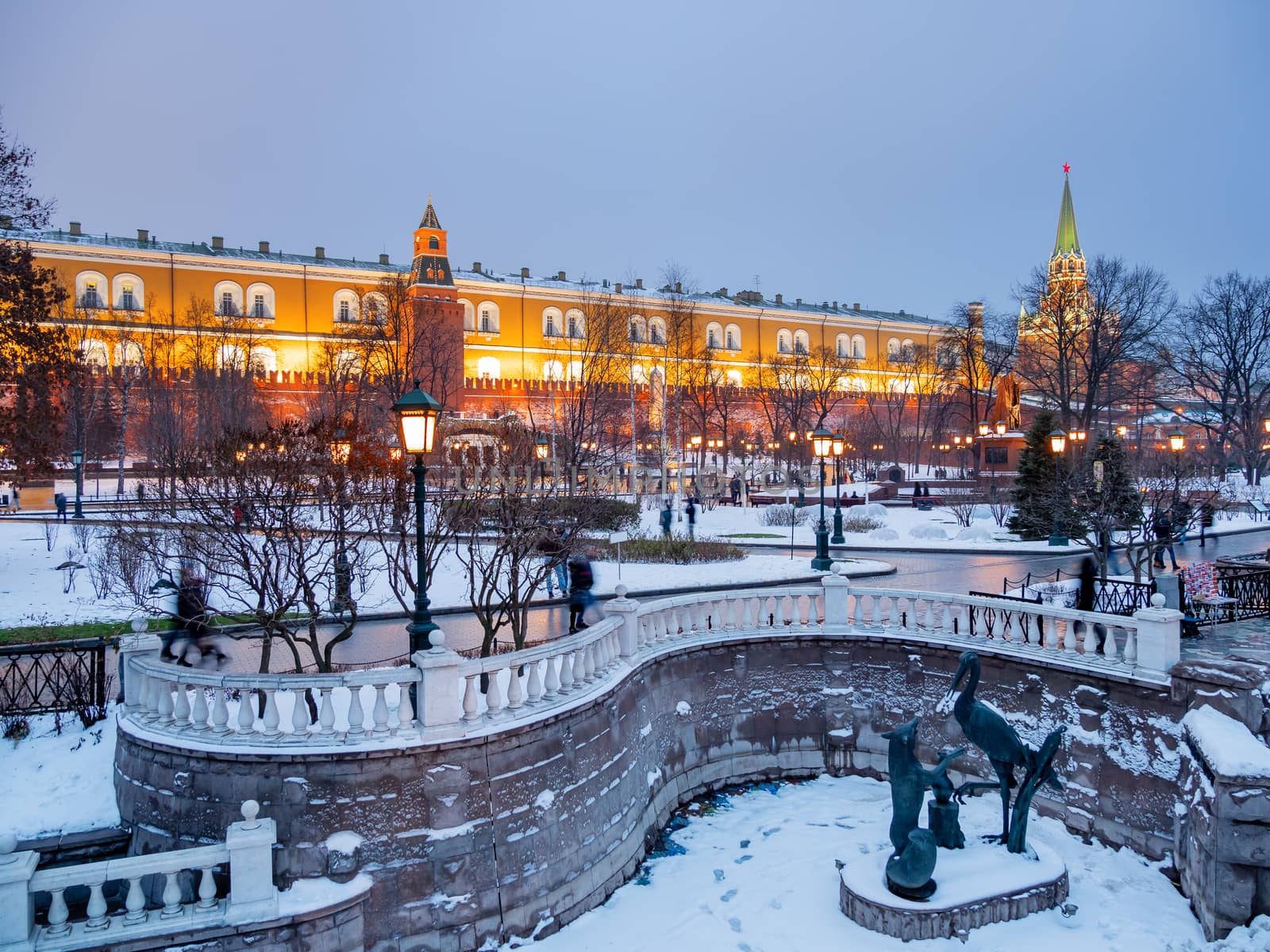 Kremlin towers and Alexander Gardens at winter evening. Moscow, Russia.