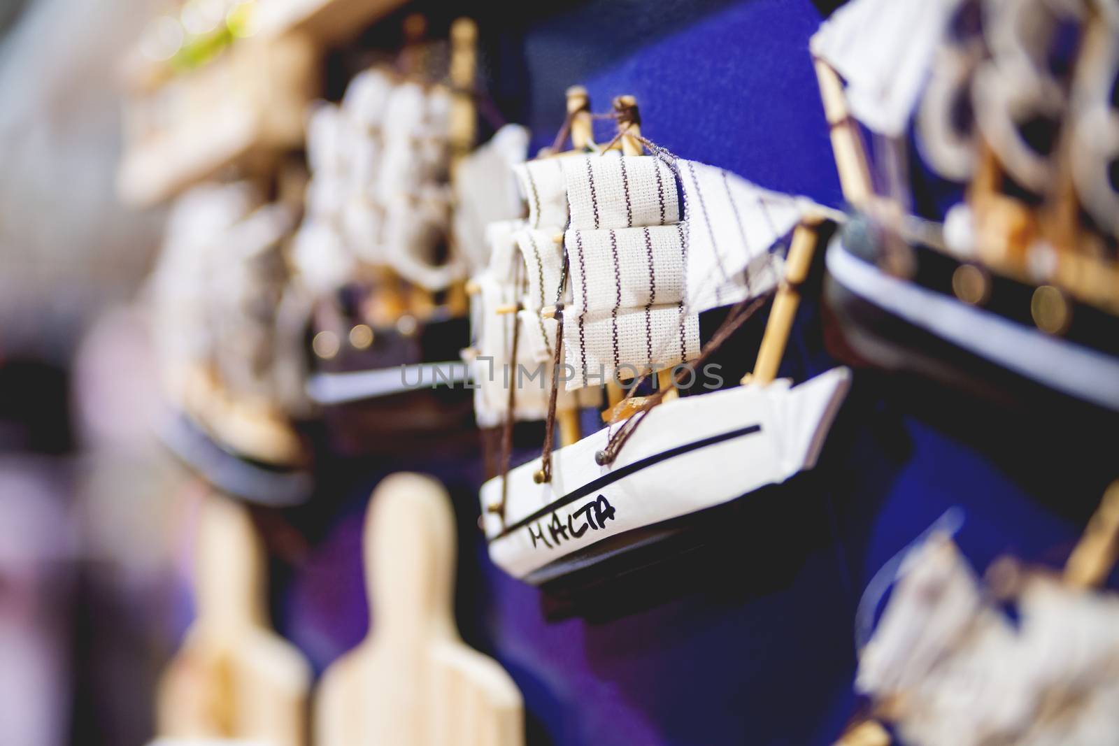 Tiny sailing ship. Traditional maltese magnet souvenir. Valletta, Malta.