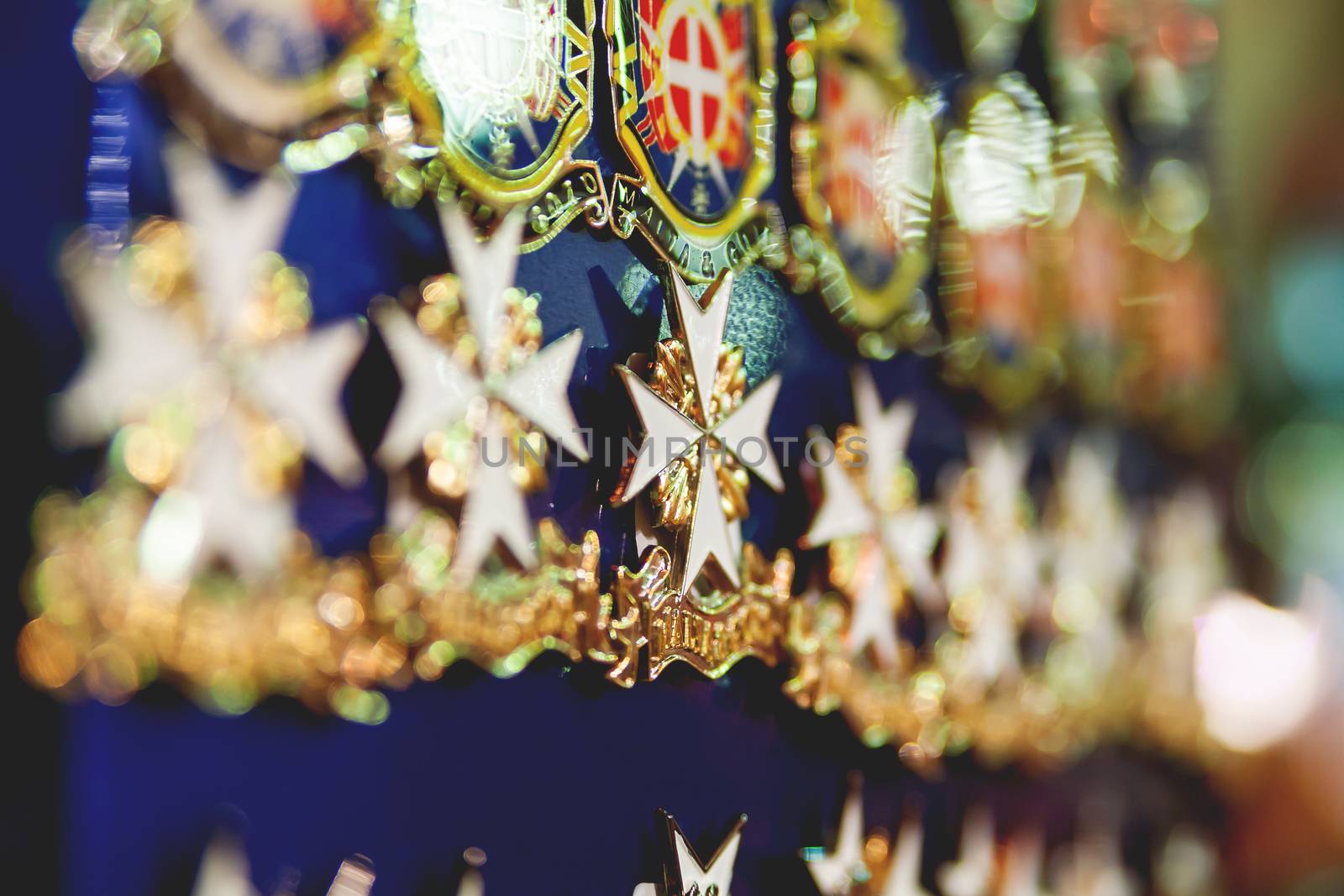 Tiny maltese cross. Traditional magnet souvenir. Valletta, Malta.