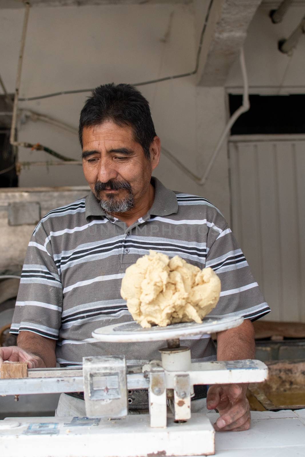 man selling dough in nixtamal mill by Tonhio