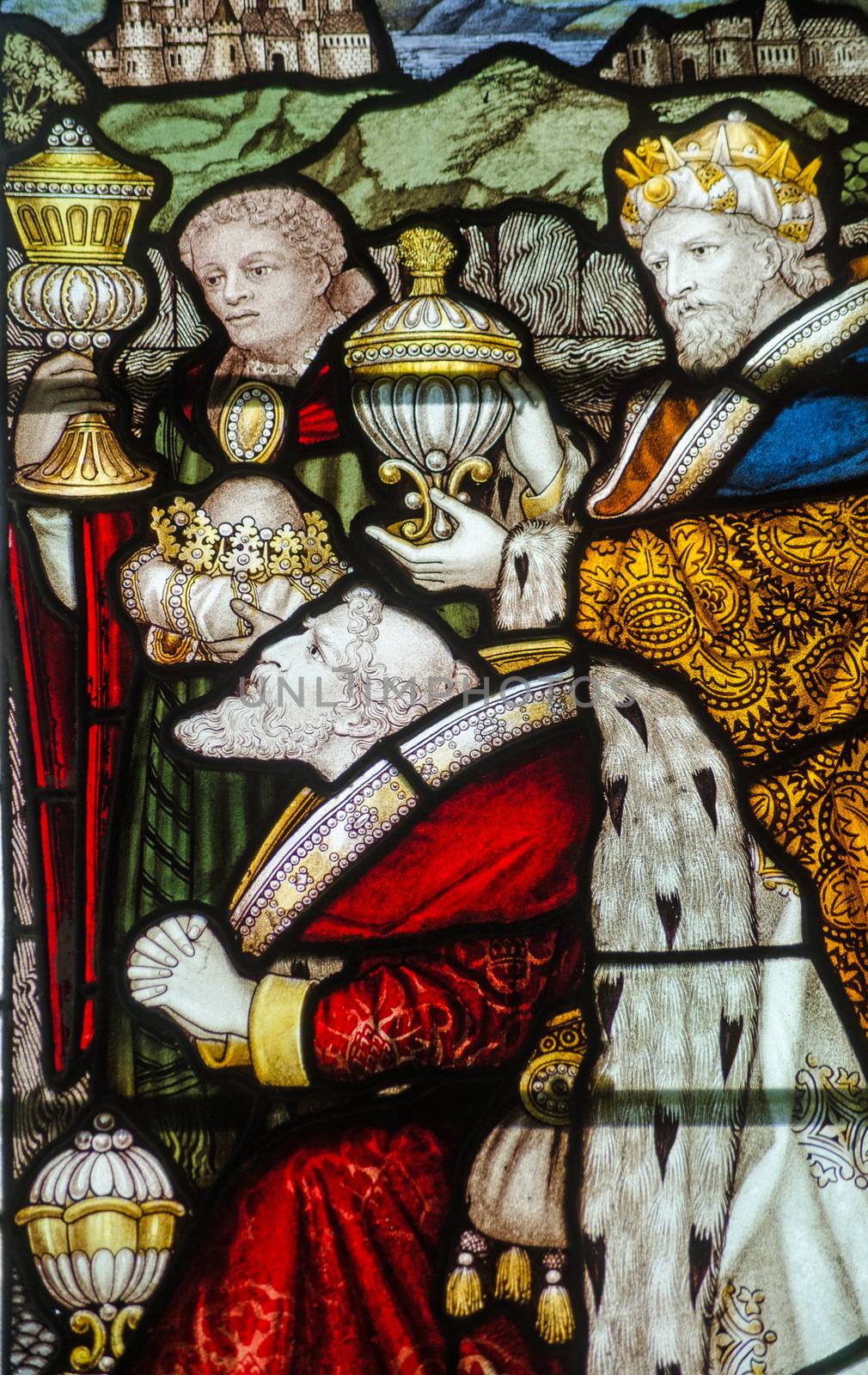 Victorian stained glass window showing the Three Kings presenting their gifts.  Historic window on public display over 100 years.  