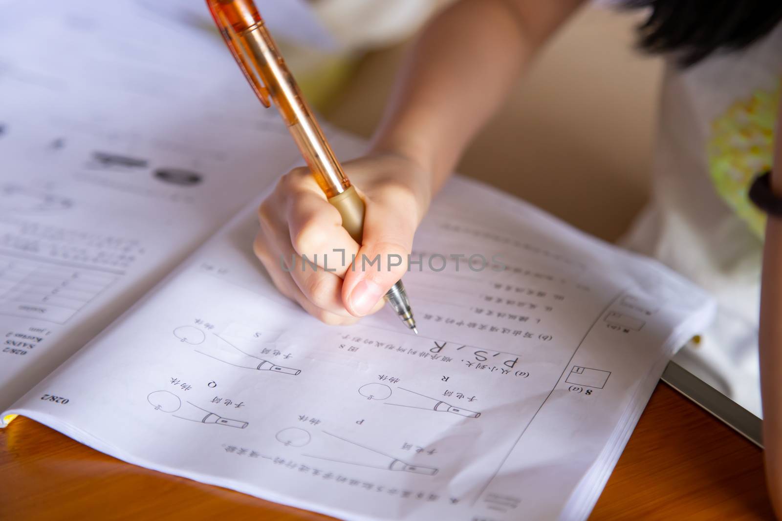 girl doing her school work with online class