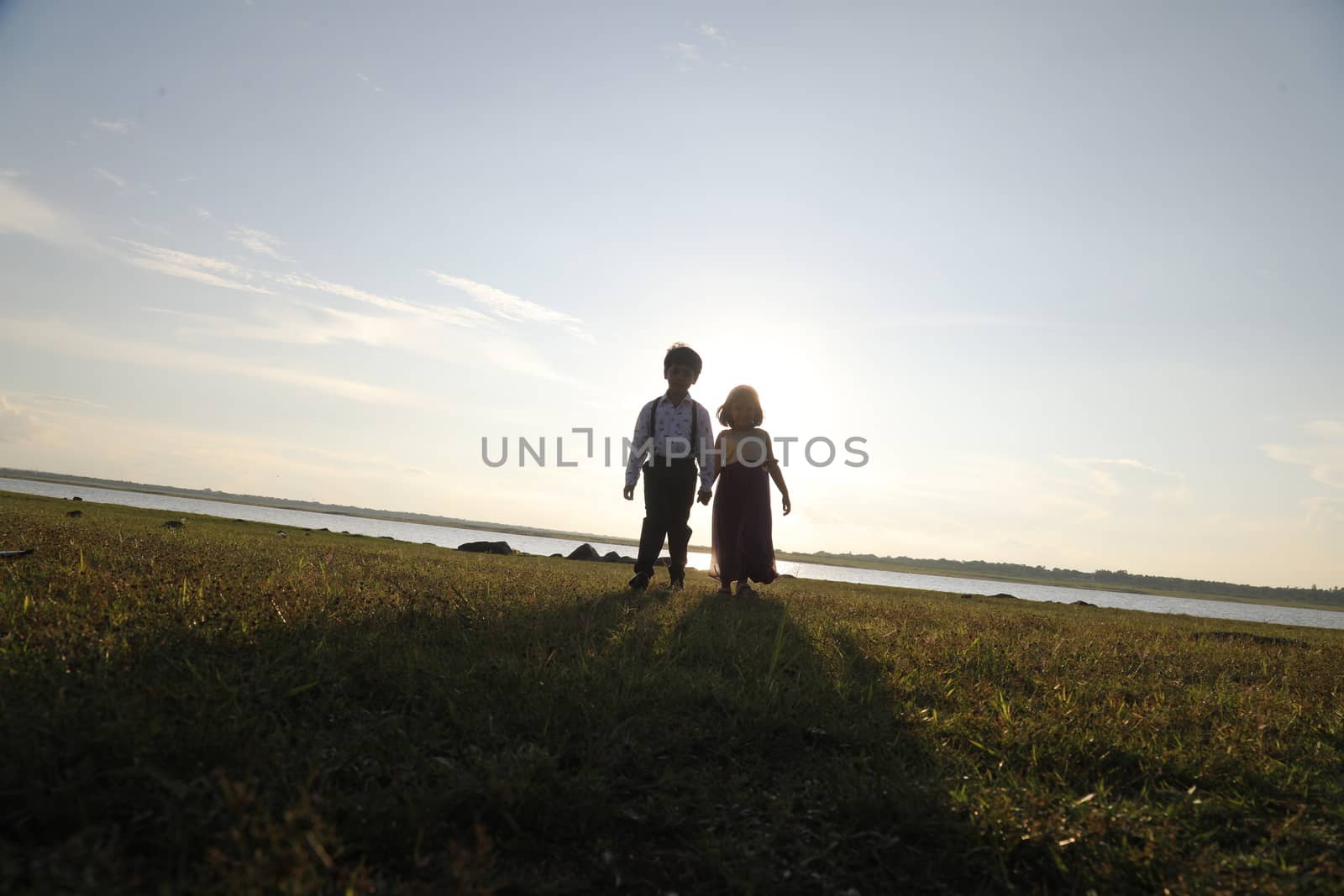 Boy and Girl silhouette in the Nature