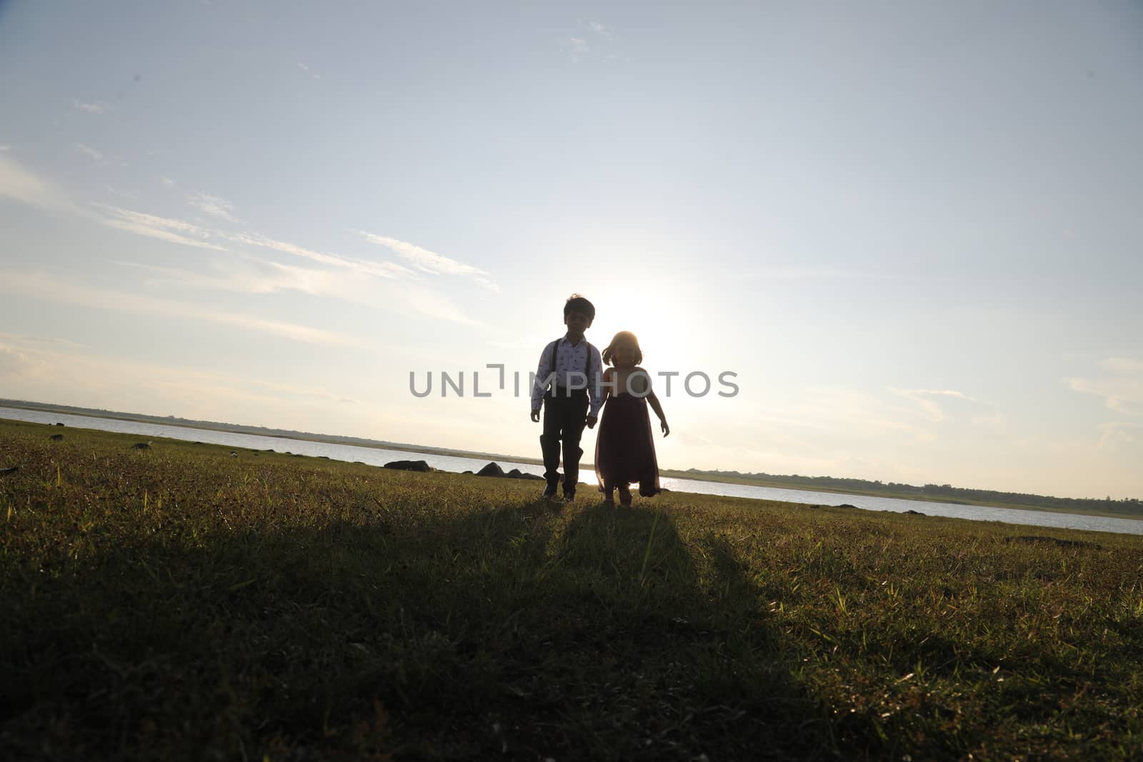 Boy and Girl silhouette in the Nature