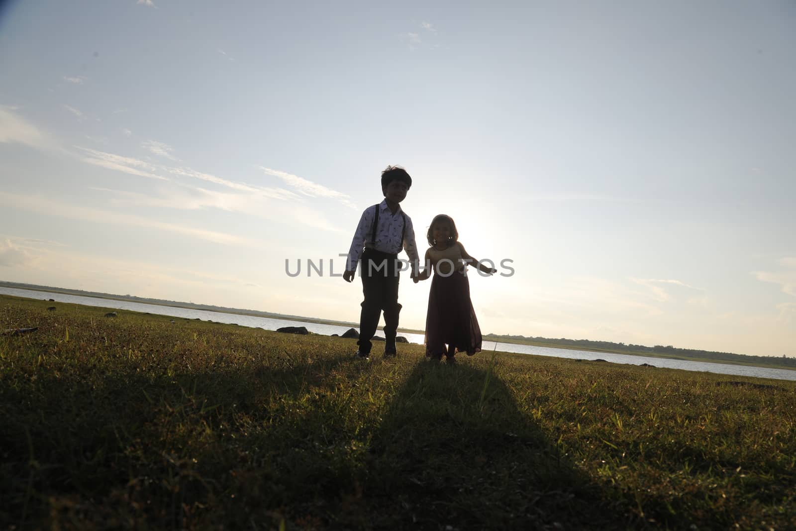 Boy and Girl silhouette in the Nature