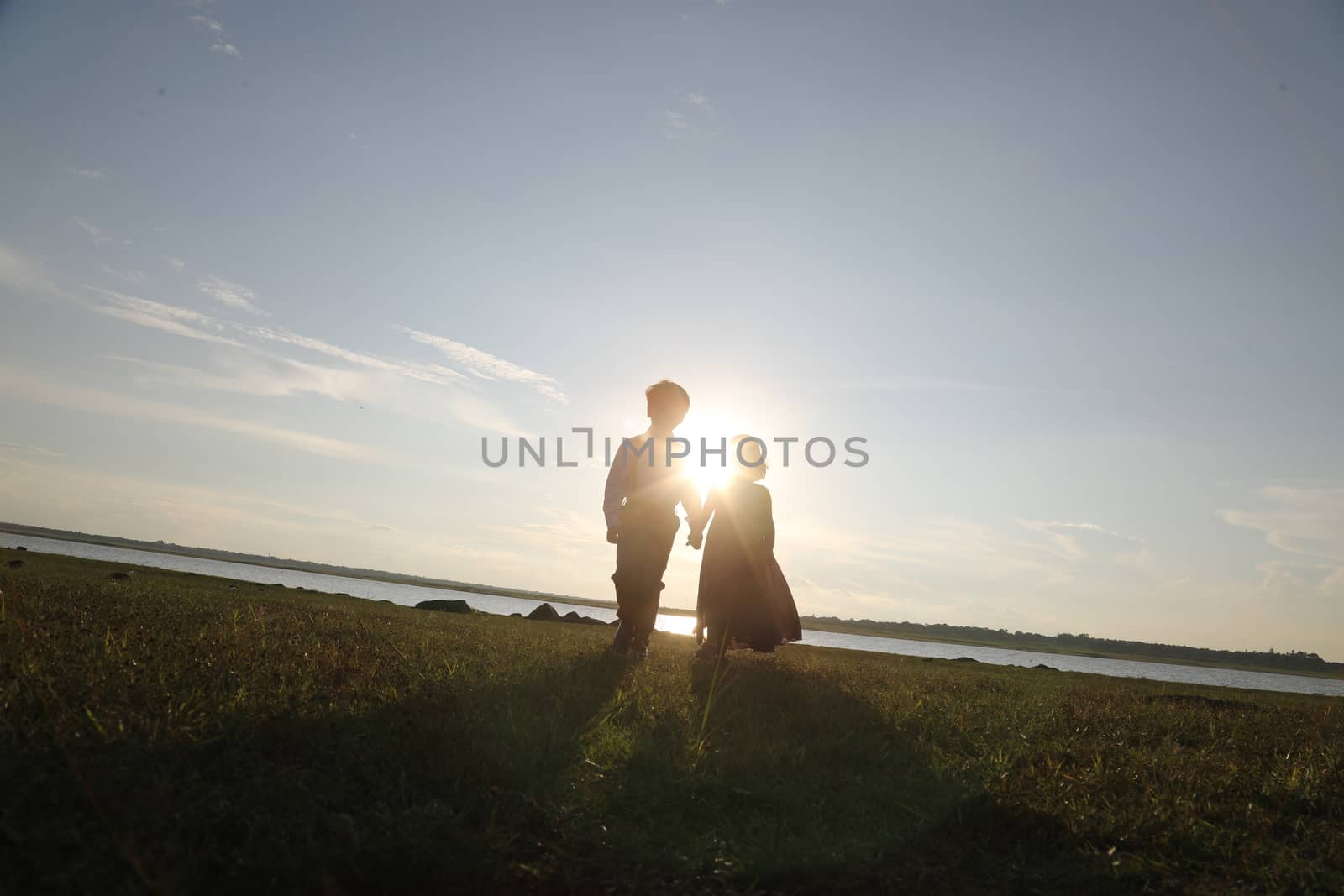 Boy and Girl silhouette in the Nature