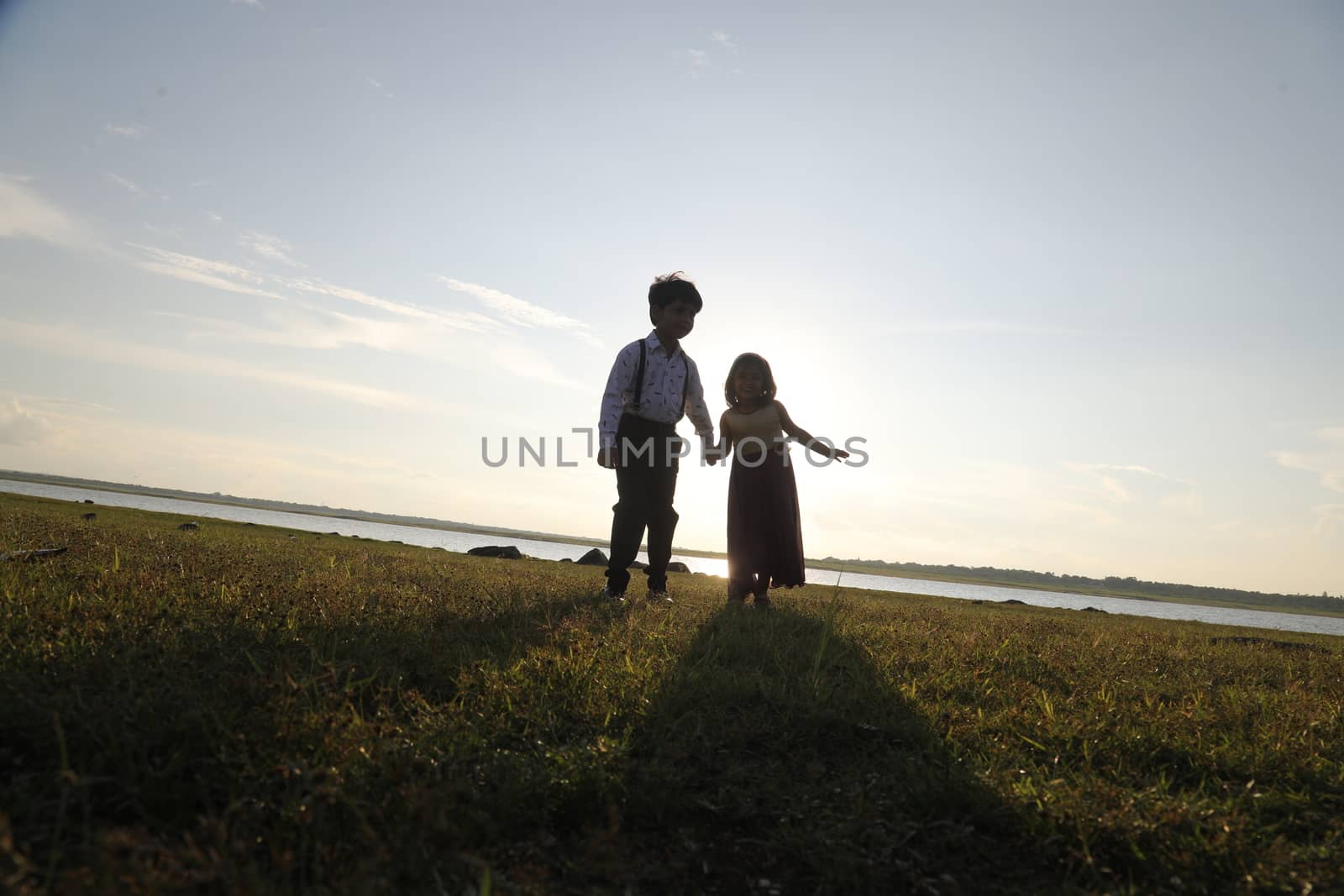 Boy and Girl silhouette in the Nature