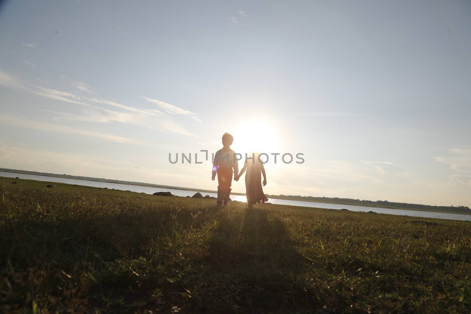 Boy and Girl silhouette in the Nature