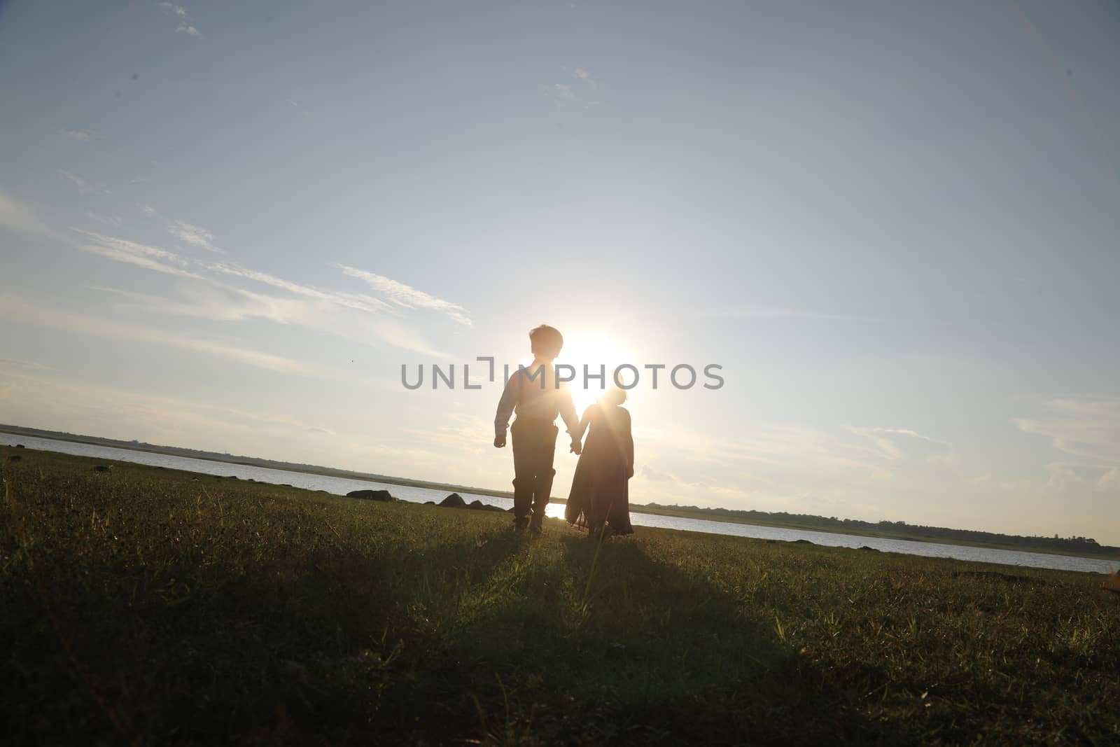 Boy and Girl silhouette in the Nature