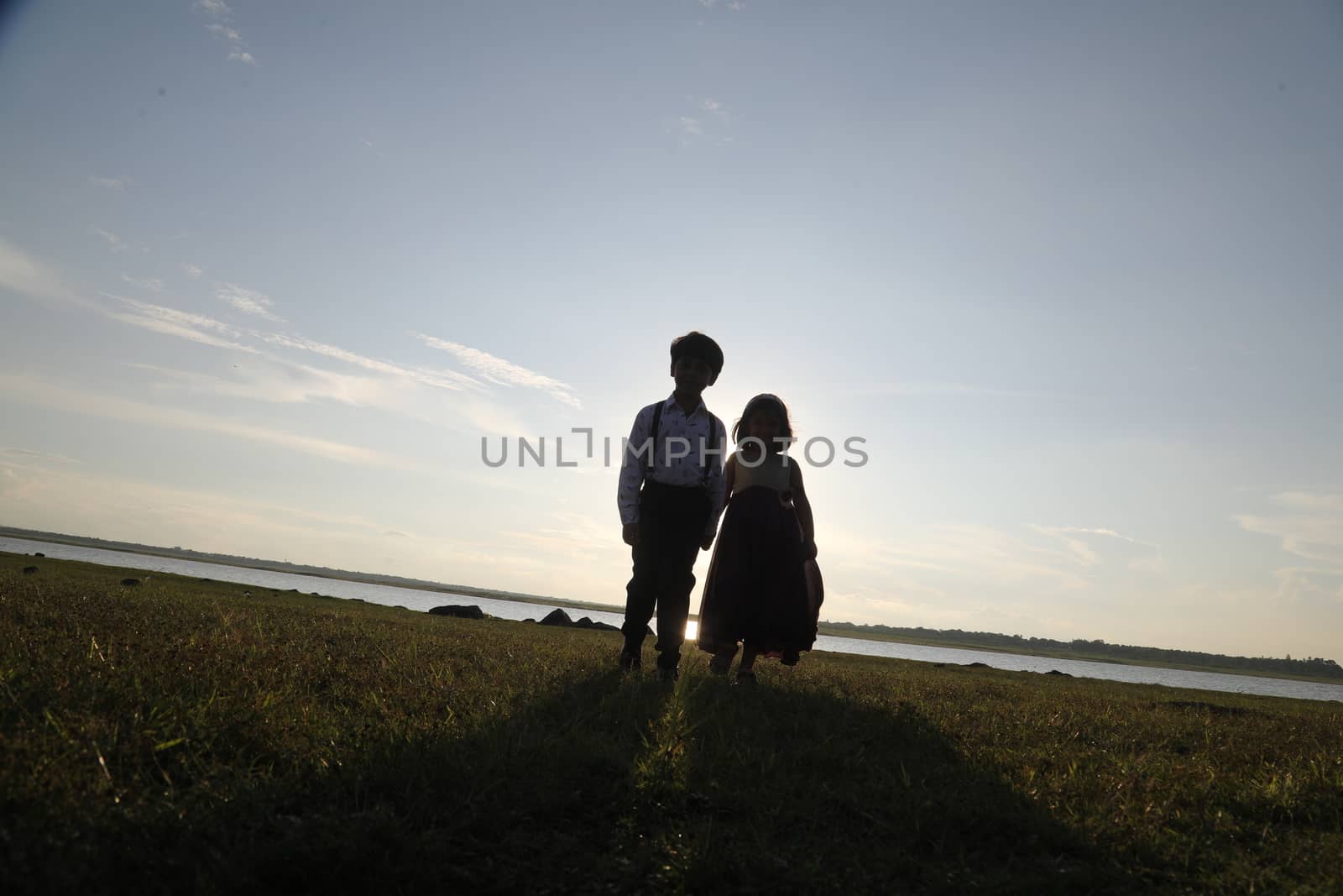 Boy and Girl silhouette in the Nature