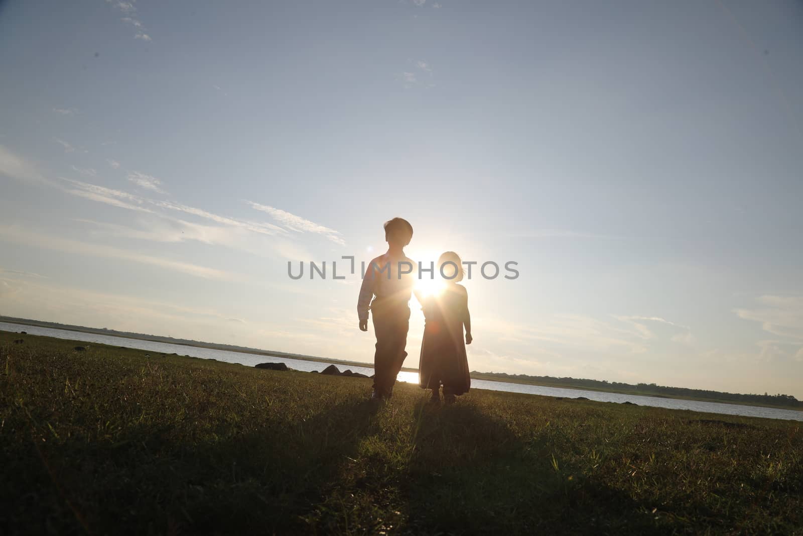 Boy and Girl silhouette in the Nature