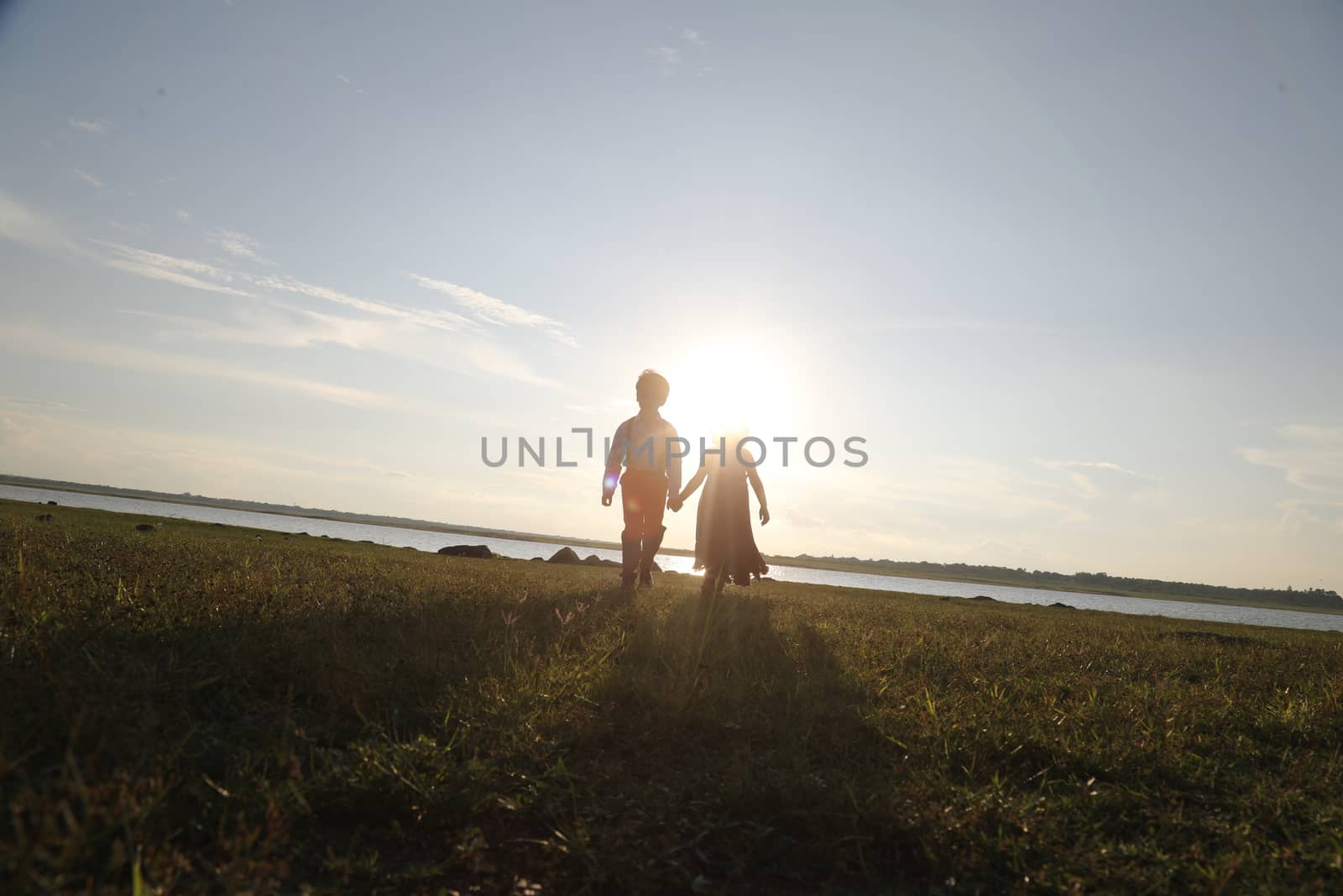 Boy and Girl silhouette in the Nature