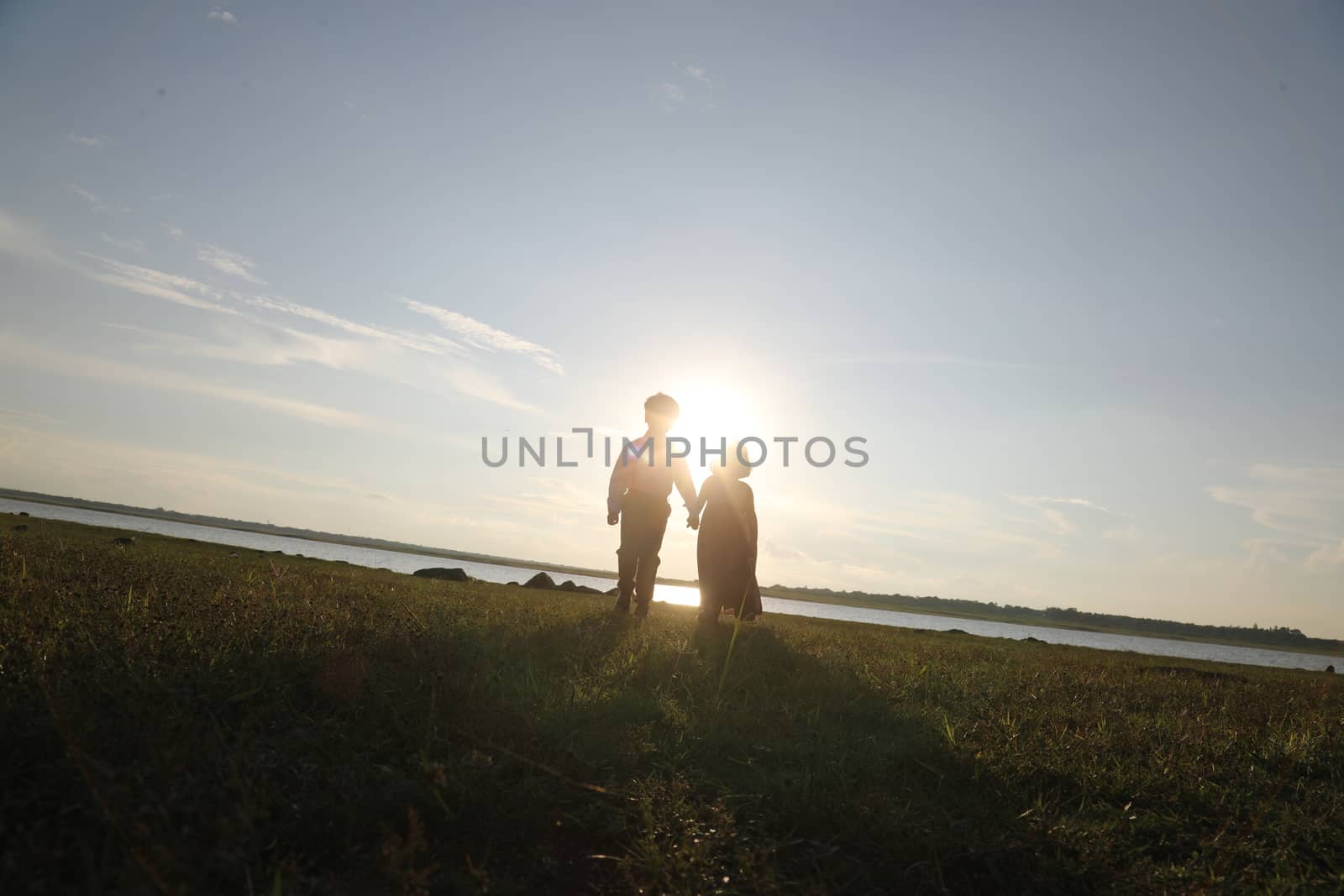 Boy and Girl silhouette in the Nature