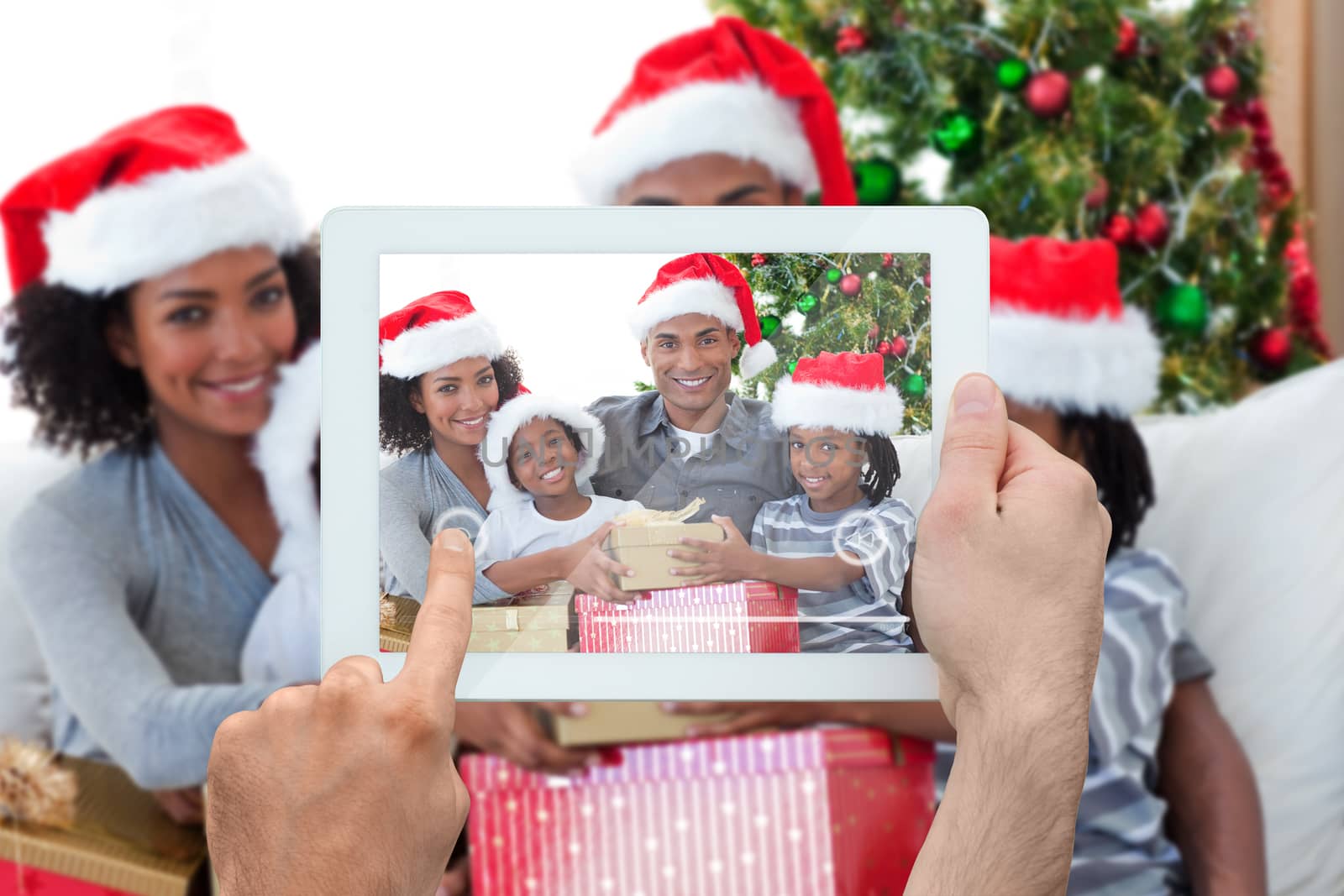 Composite image of hand holding tablet pc showing photograph