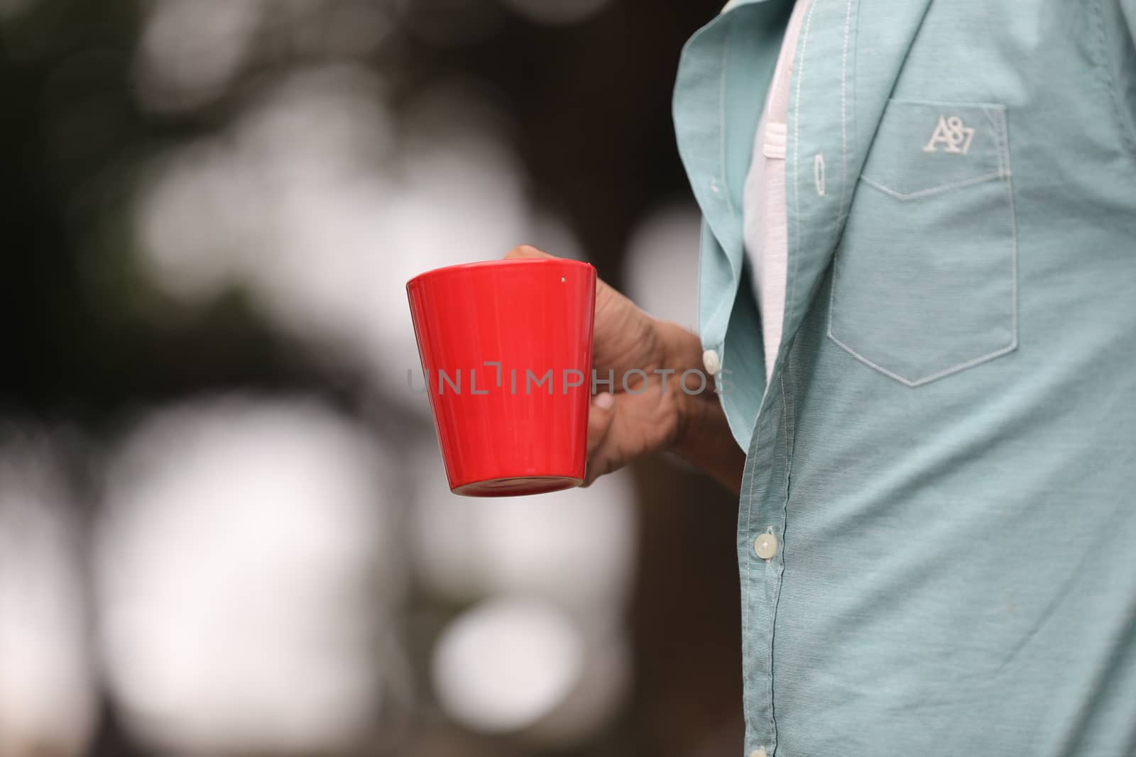 Male hand with cup