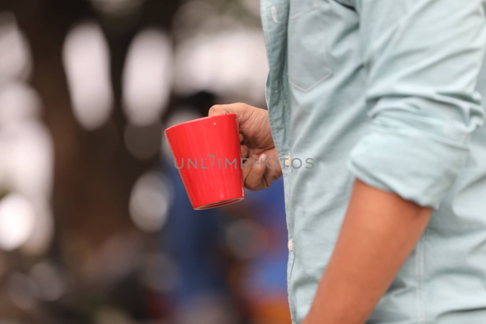 Male hand with cup