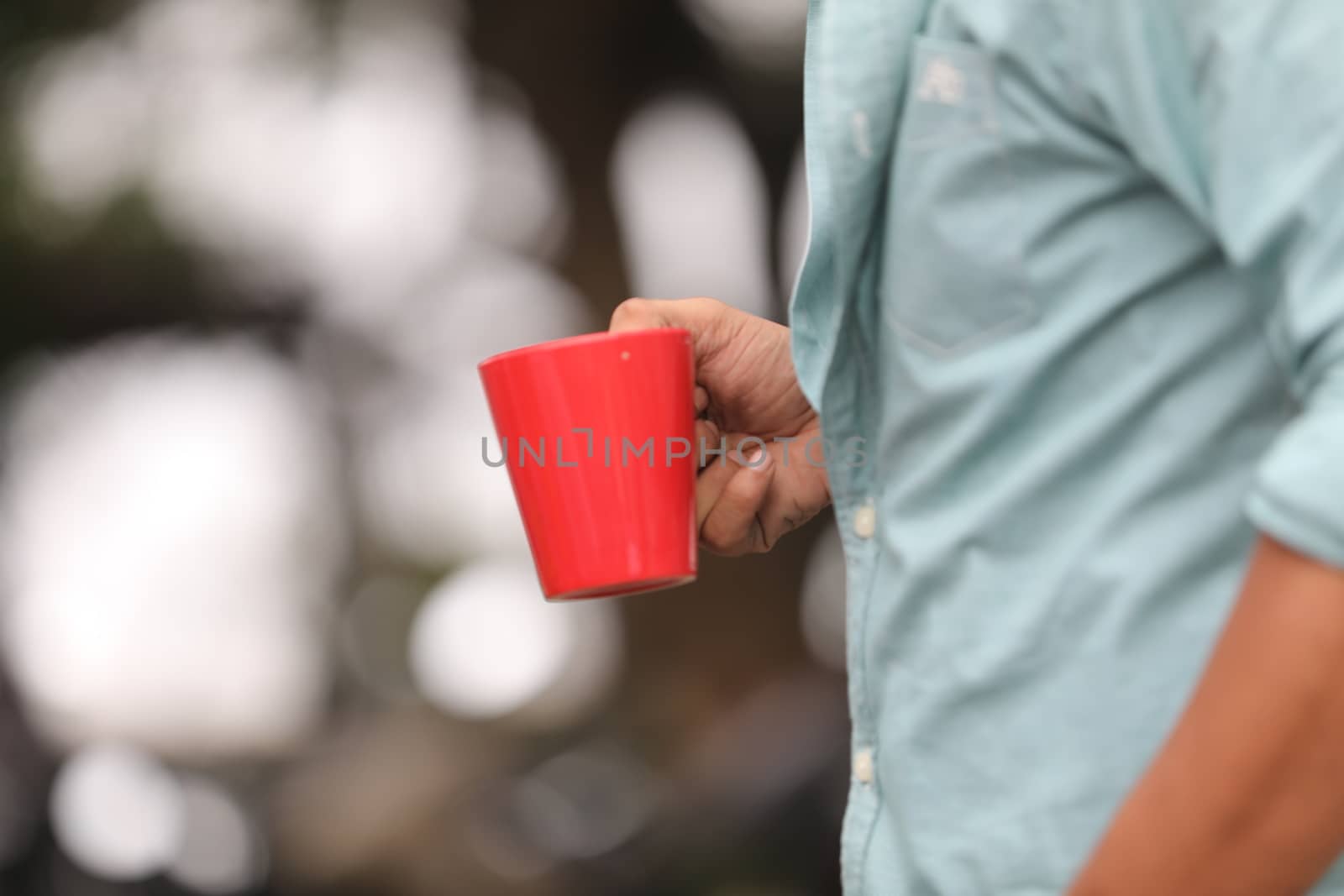 Male hand with cup