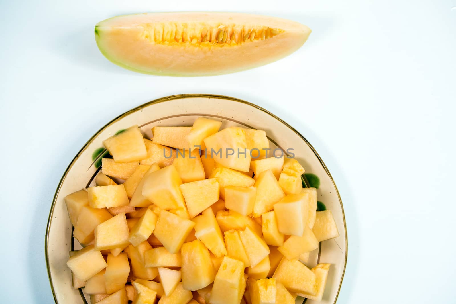 Small pieces of cantaloupe in the ceramic plate