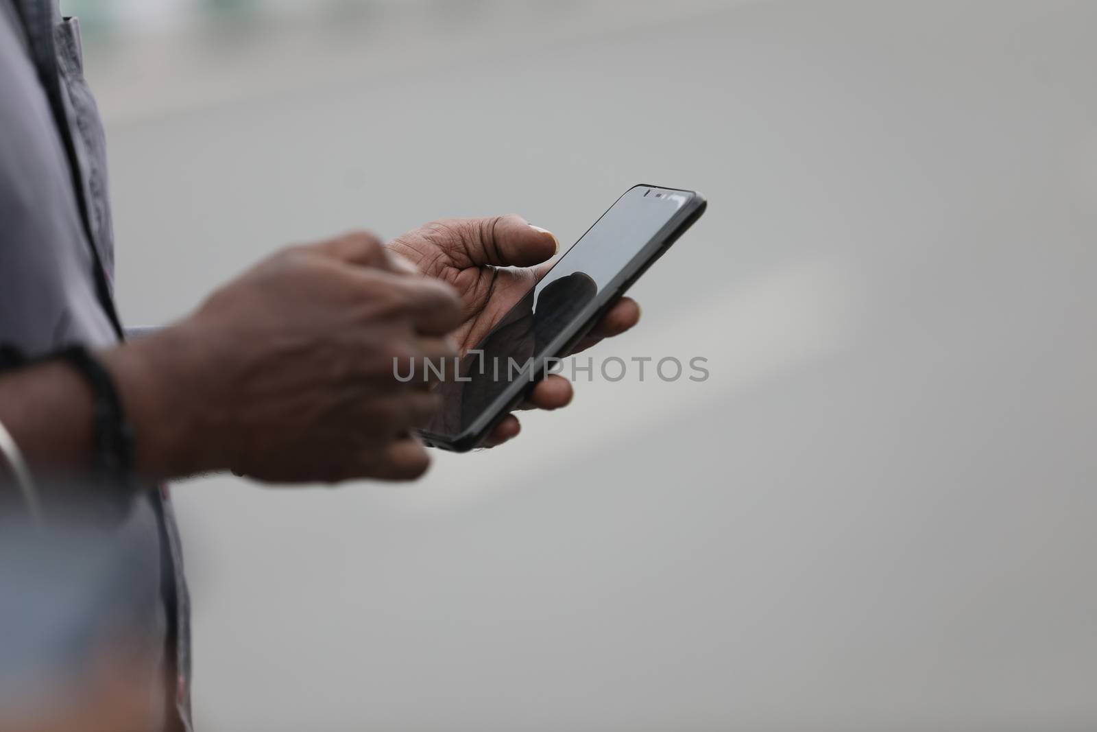 Male Model hands with cell phone by rajastills