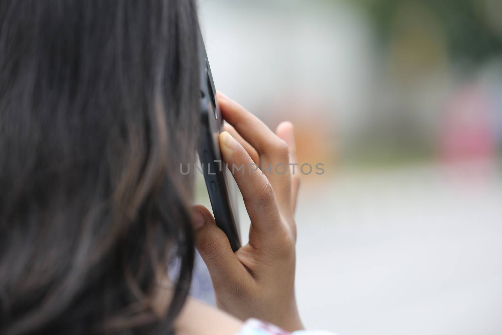 Female hands with cell phone