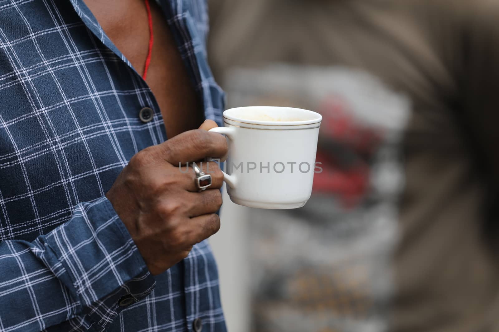 Male hand with cup
