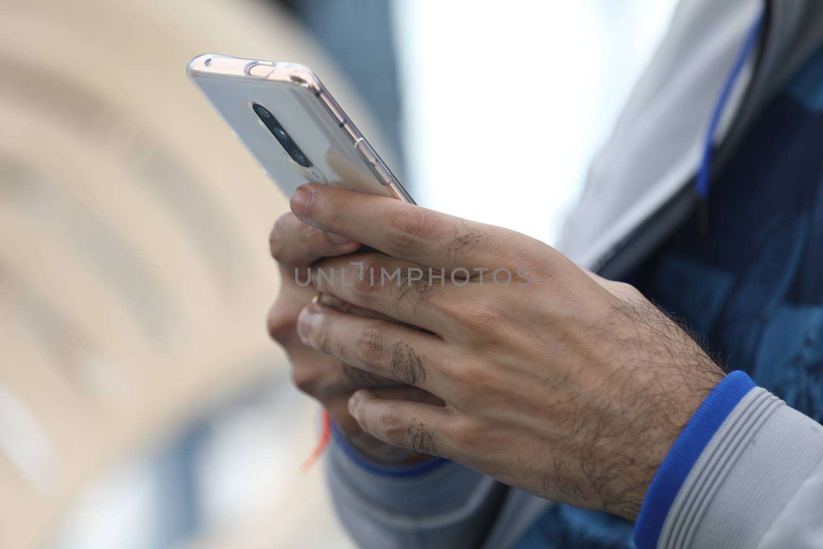 Male Model hands with cell phone by rajastills