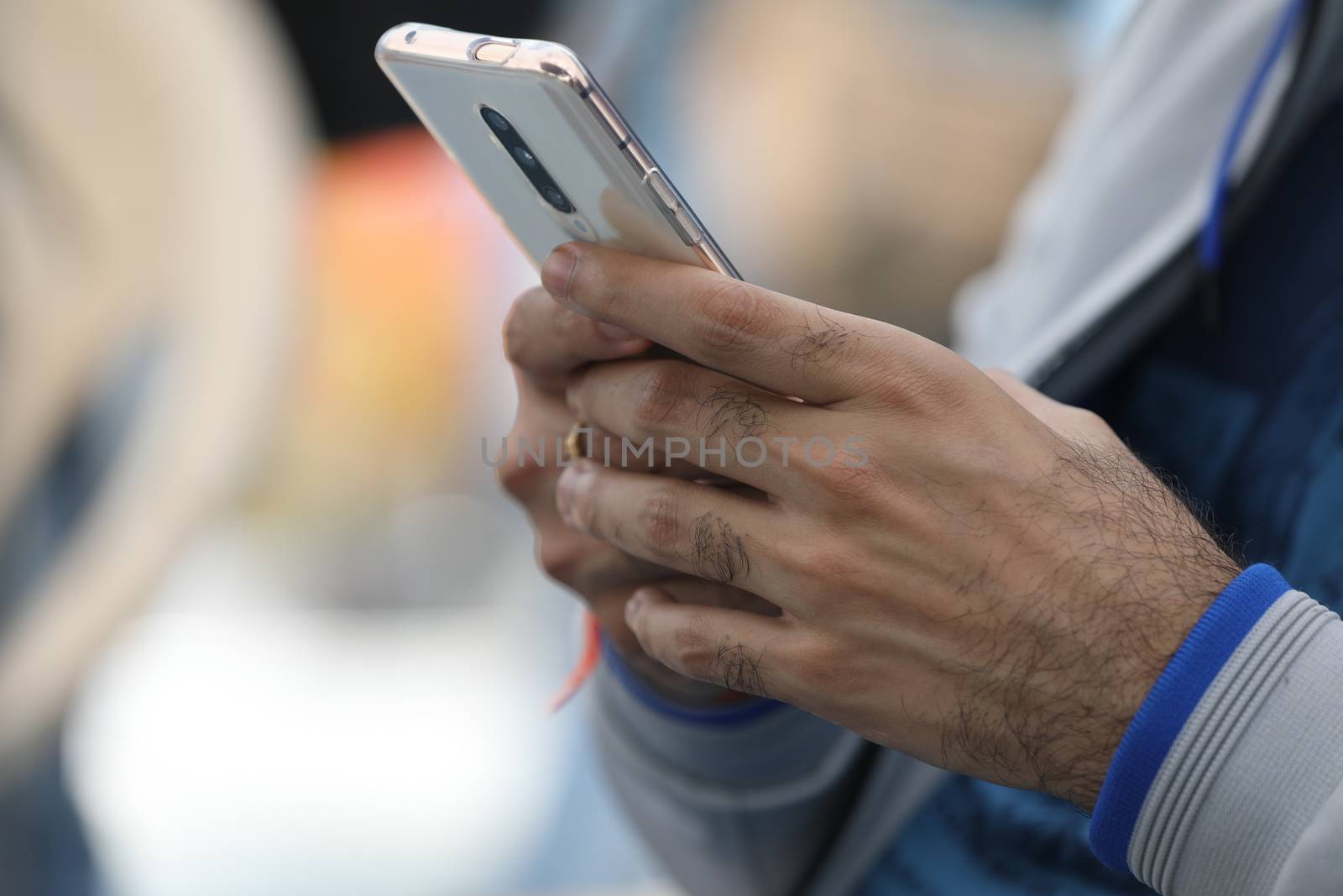 Male Model hands with cell phone by rajastills