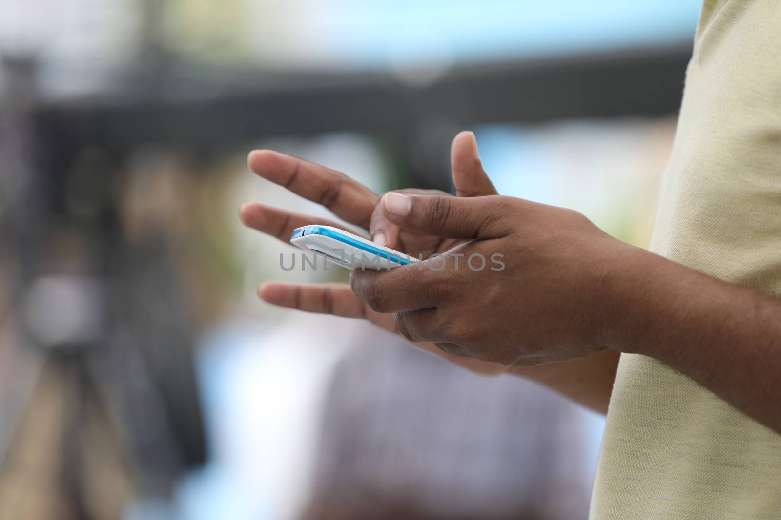 Male Model hands with cell phone by rajastills