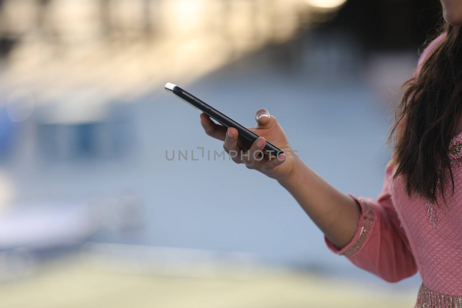 Female hands with cell phone by rajastills