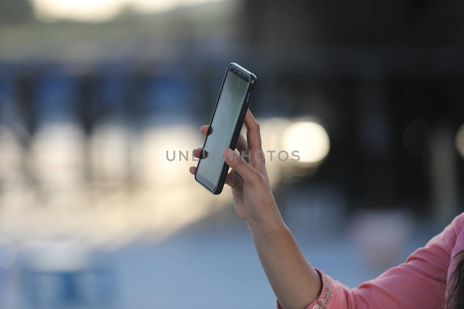 Female hands with cell phone by rajastills