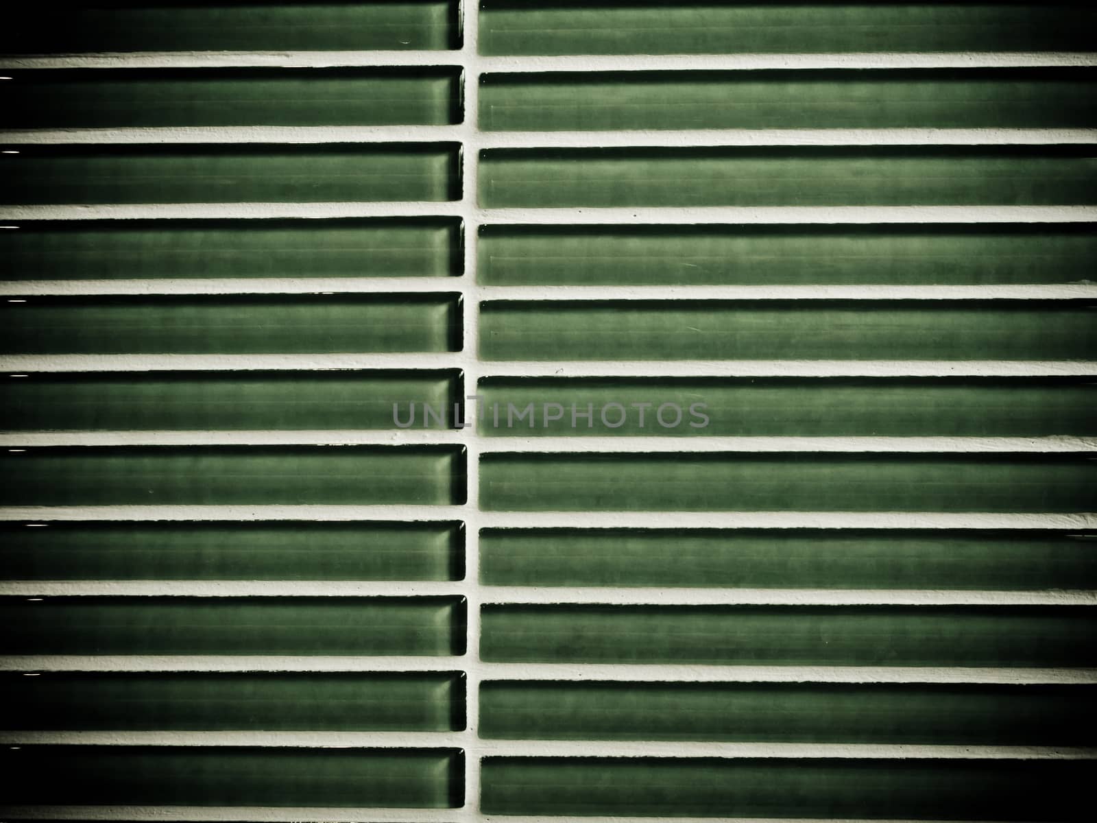 The texture of green ceramic tiles wall by Satakorn