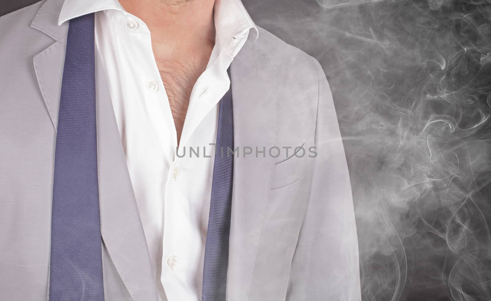 Man in a grey suit, standing in smoke, close-up by michaklootwijk