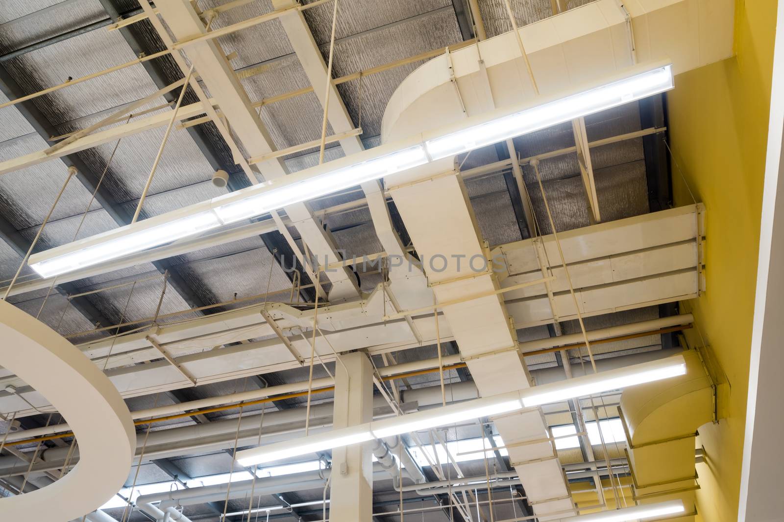 Ceiling mounted Lamps pipes and air ducts and communication system in the hall