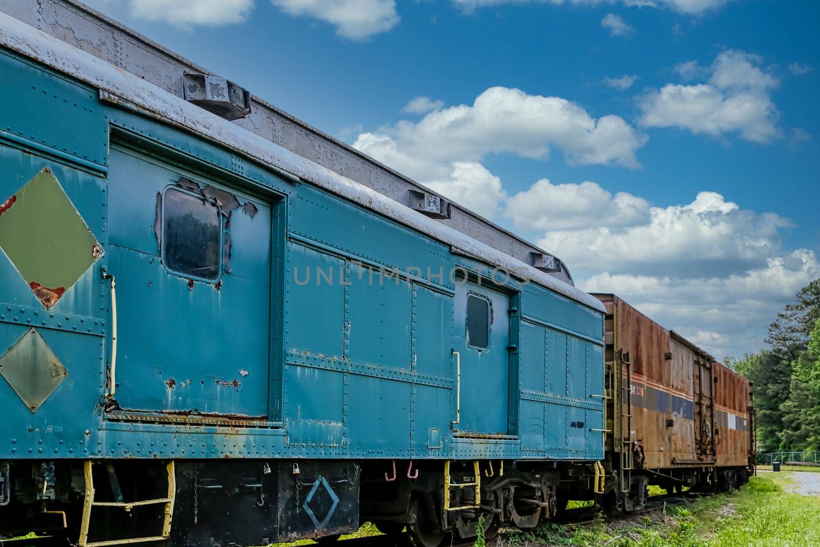 An old abandoned railroad train on tracks