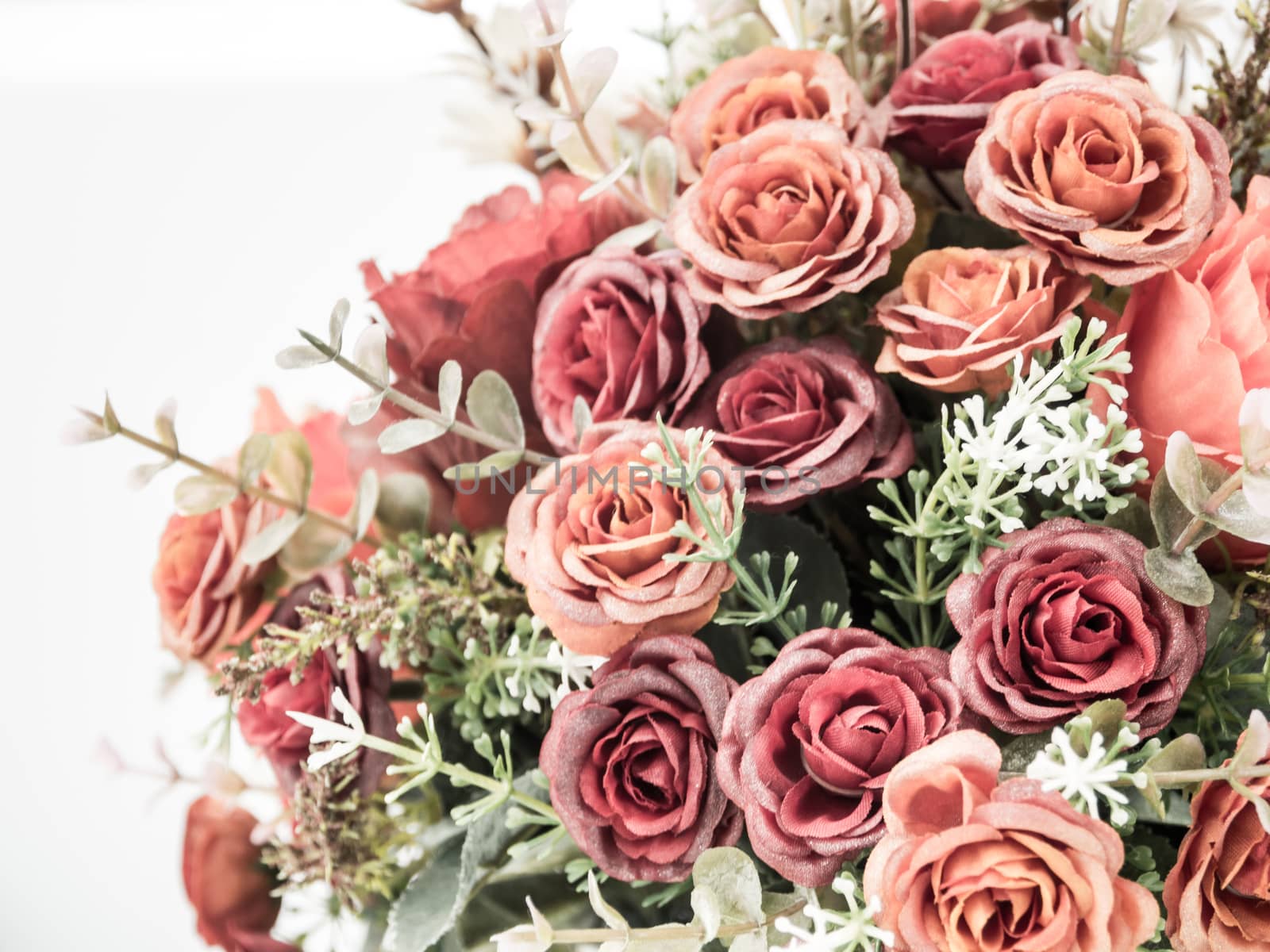 Plastic roses in artificial flower bouquet by Satakorn