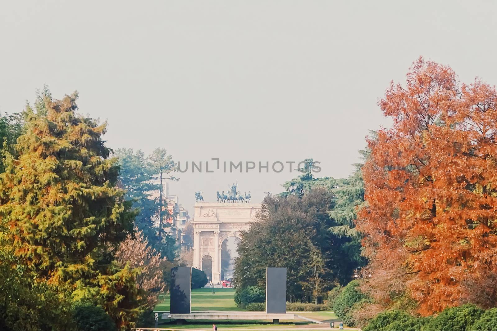 Autumn nature in park, fall leaves and trees outdoors, beautiful season in Milan, Lombardy region in Northern Italy