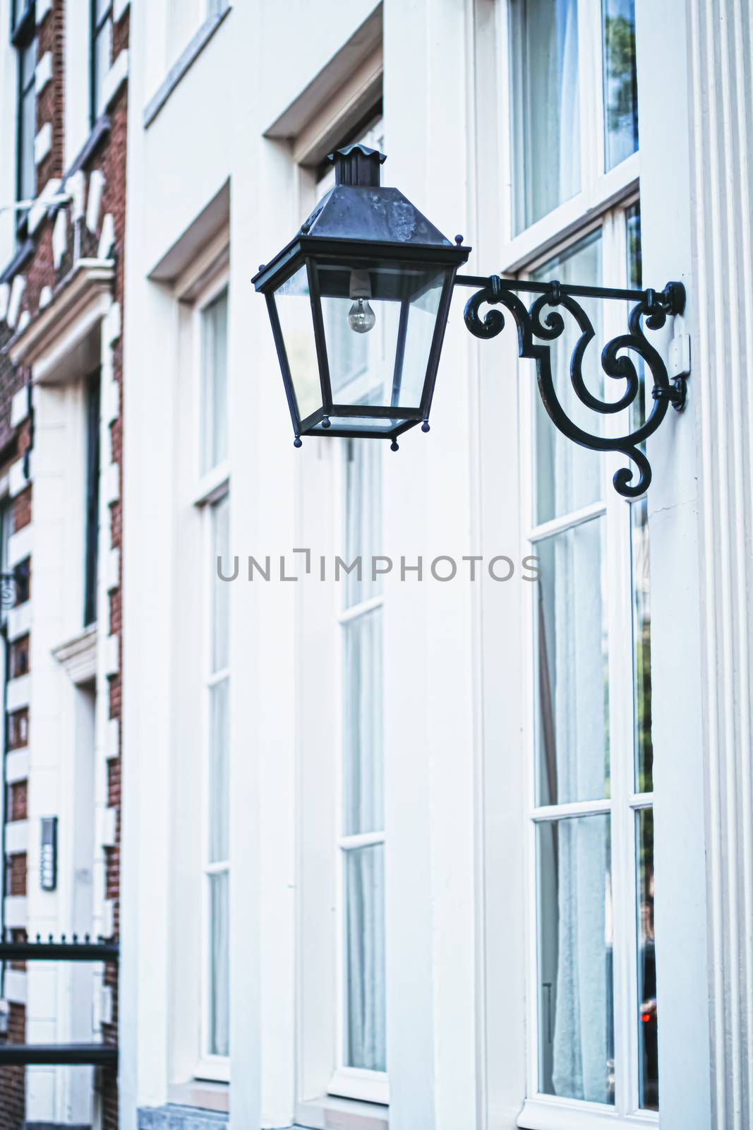 Architectural detail of a building on the main city center street of Amsterdam in Netherlands, european architecture