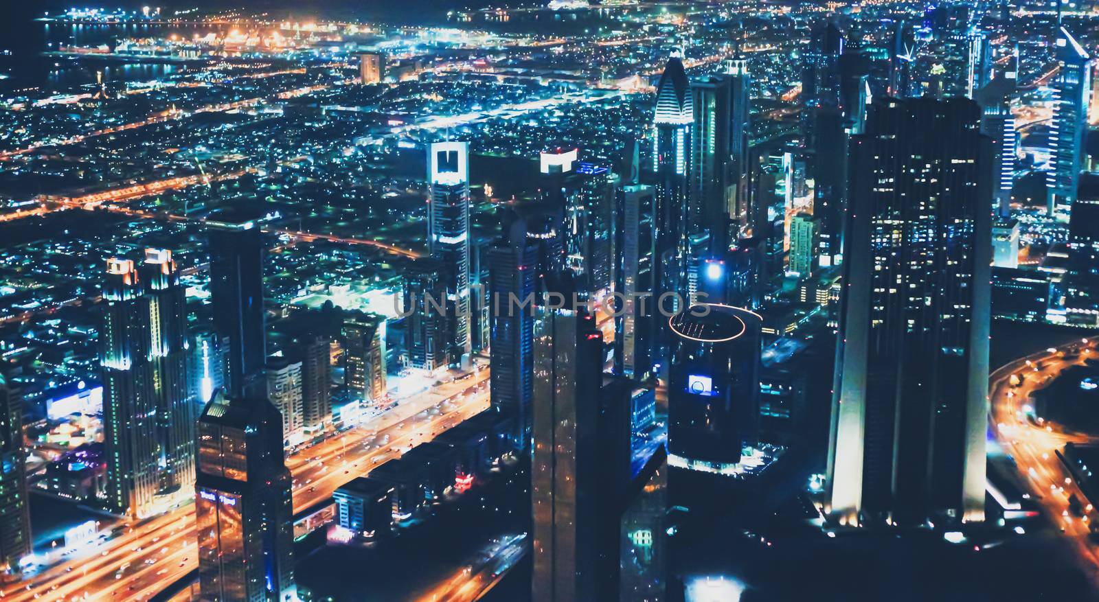 Aerial night view of Dubai in United Arab Emirates, metropolitan cityscape scenery