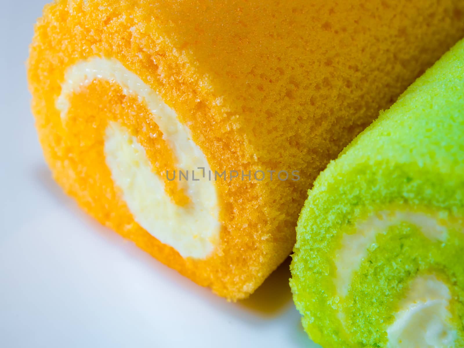 Green pandan and Orange flavor roll cake by Satakorn